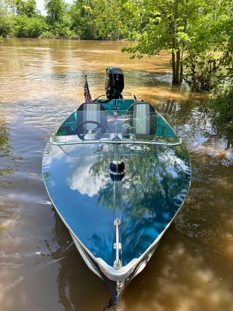 Richline Knight Deluxe 1958 boat on calm river.