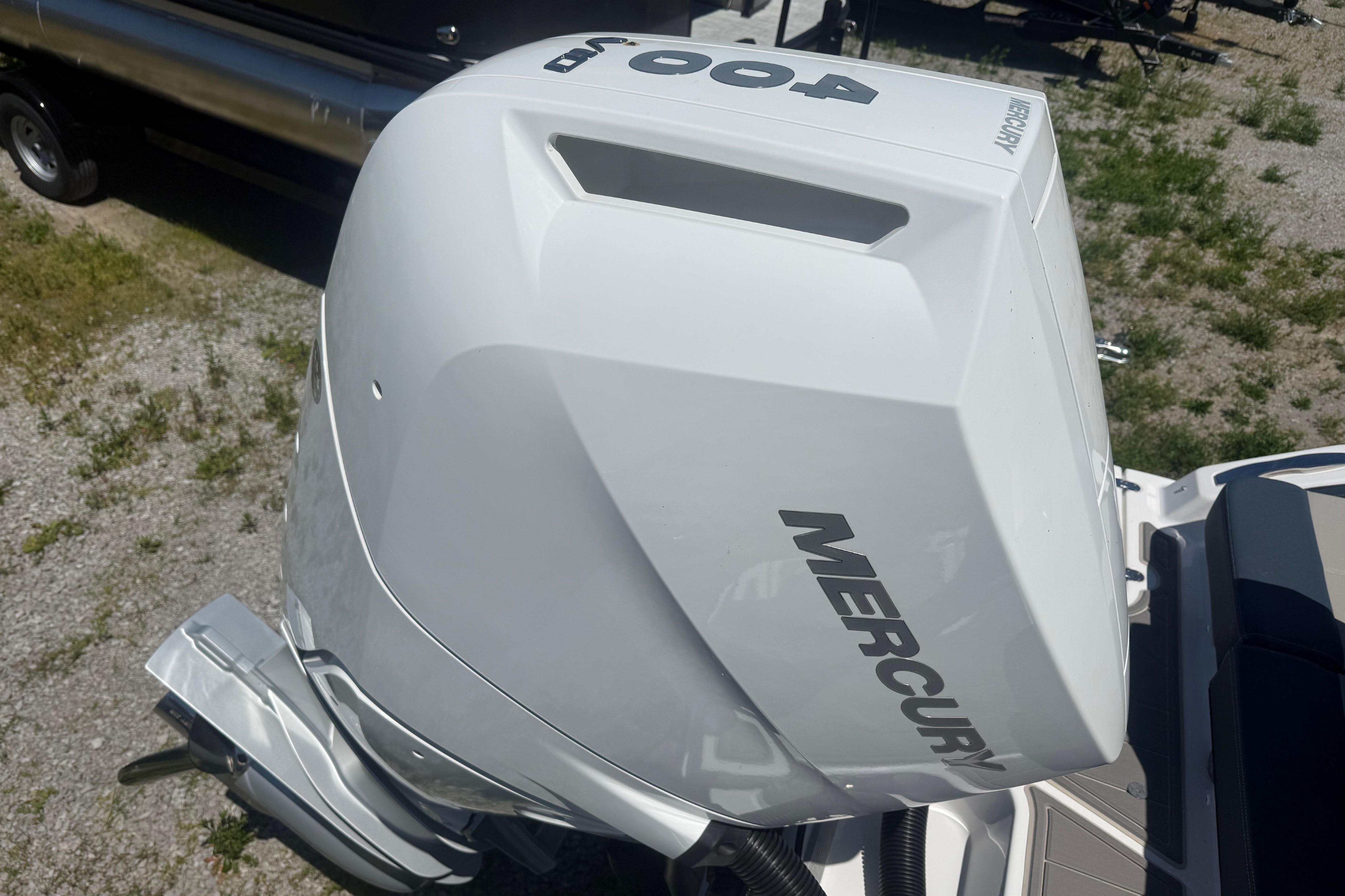 Outboard motor on 2025 Monterey Elite 27 OB boat, featuring Mercury branding.