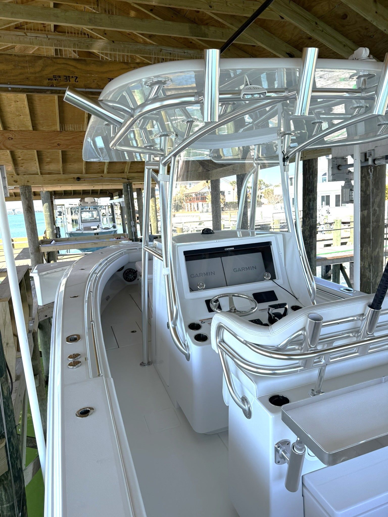 2025 Contender 32 ST boat docked with modern helm console.
