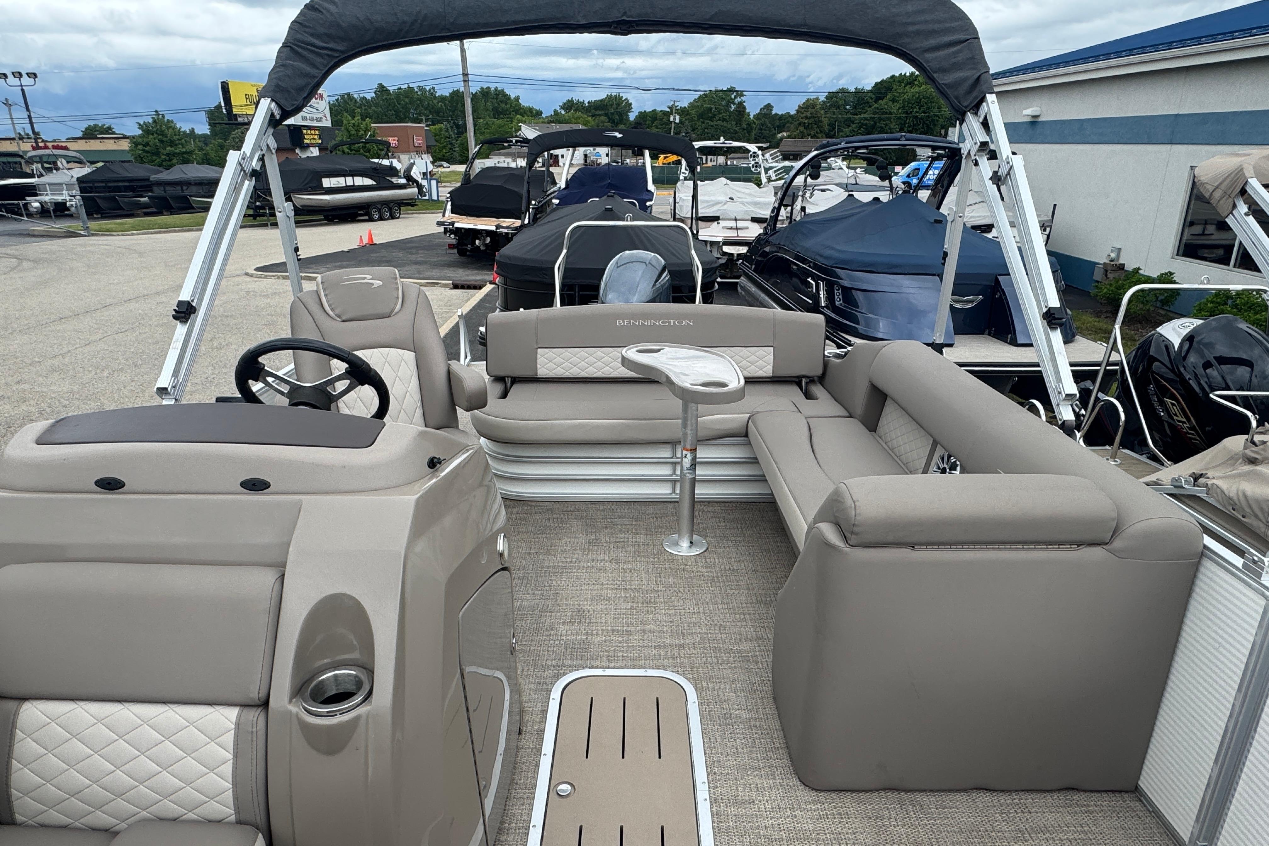 2019 Bennington SX 22 SSBXP pontoon boat interior with seating and helm.