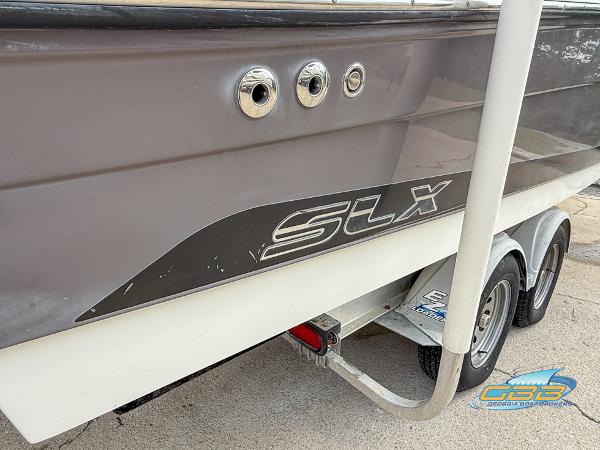 2008 Sea Ray 270 SLX boat on trailer, side view with SLX logo.