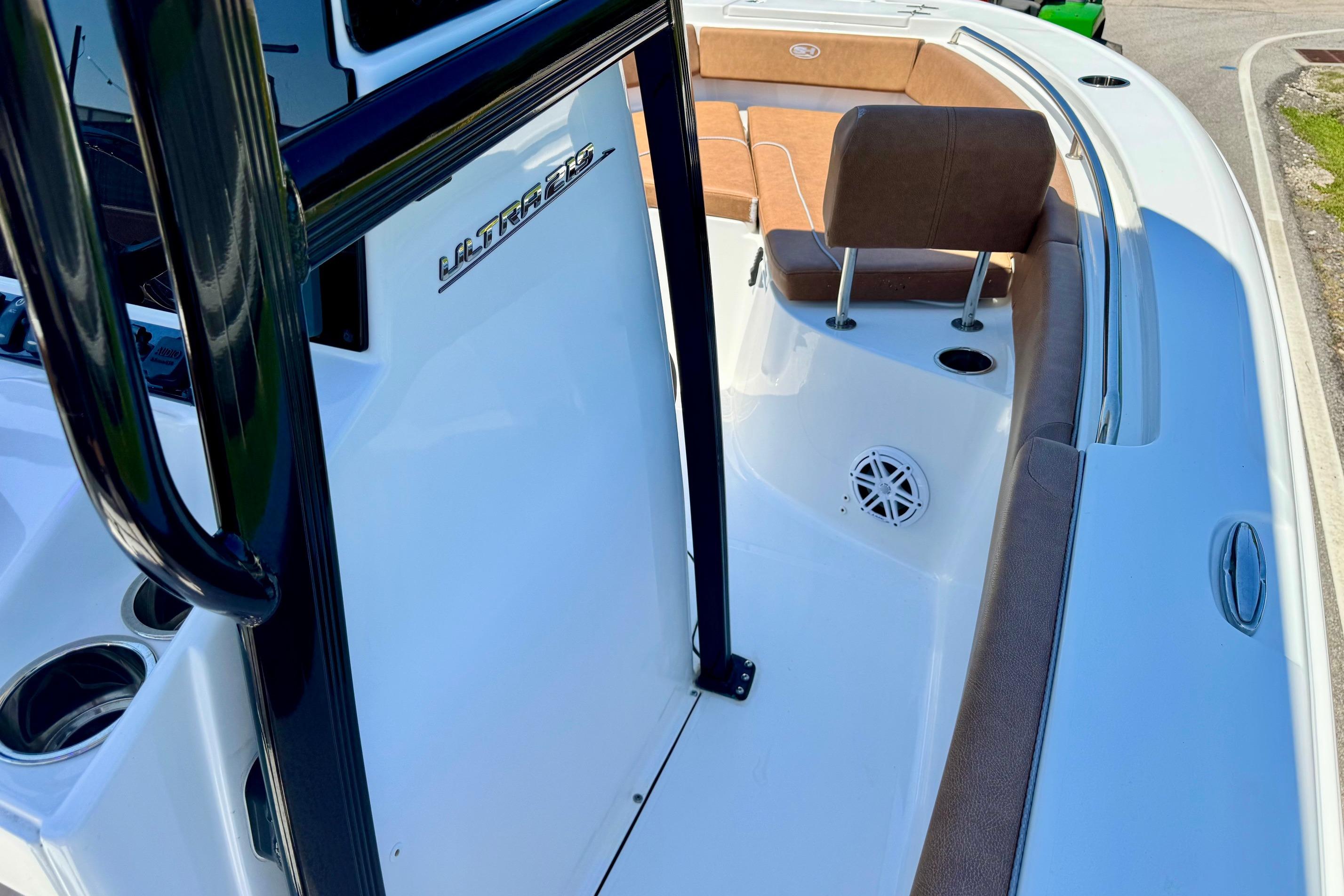2025 Sea Hunt Ultra 219 boat interior with seating and speaker detail.