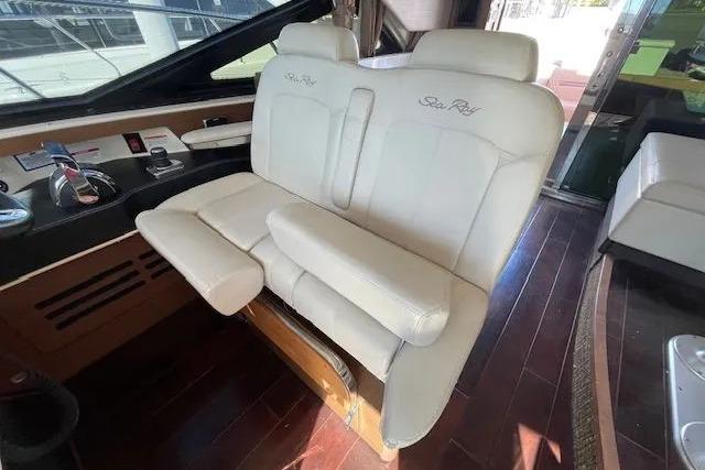 2016 Sea Ray Sundancer 510 interior with plush seating and elegant wood flooring.