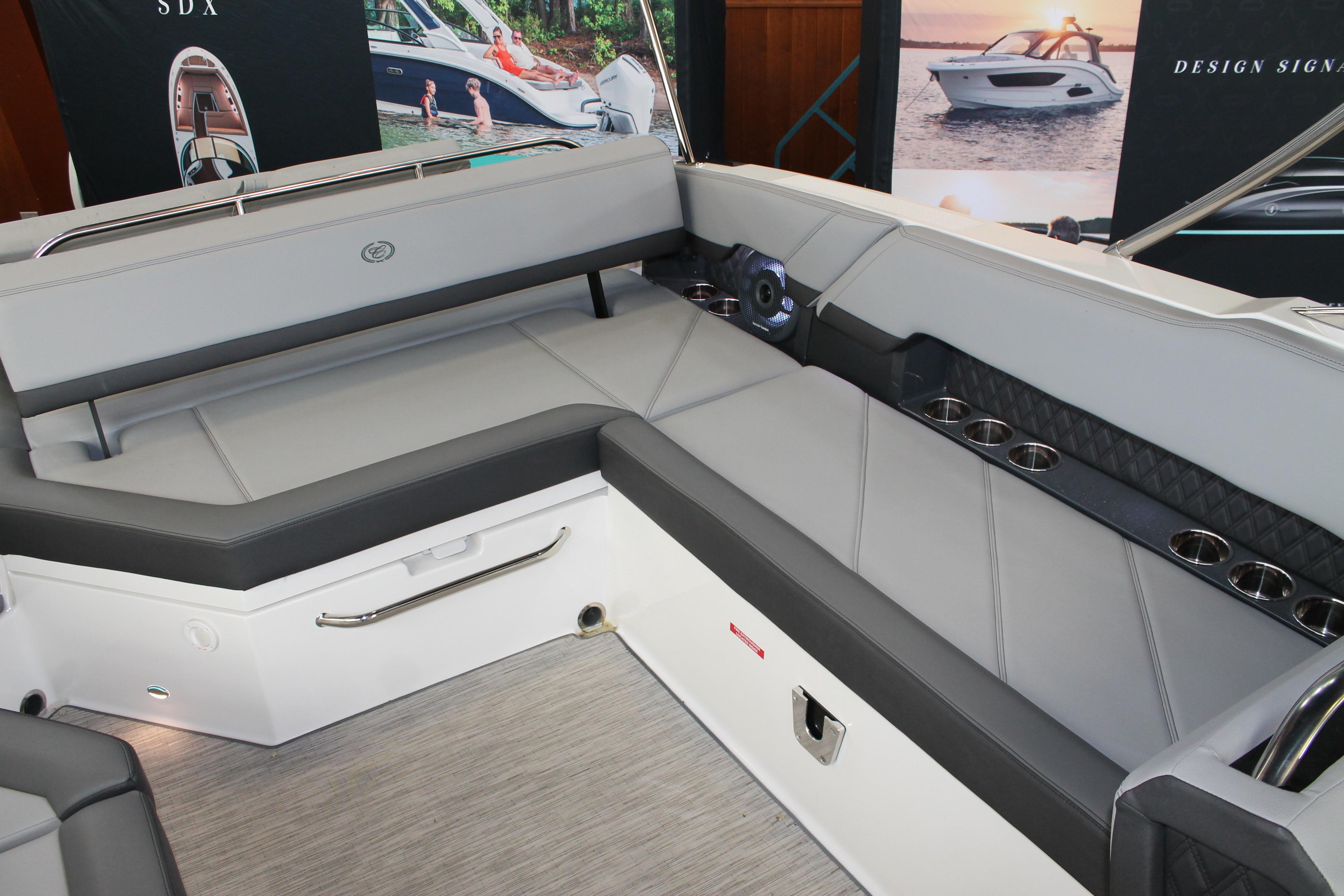 Luxurious seating area on 2023 Cobalt R8 boat with sleek design and cup holders.