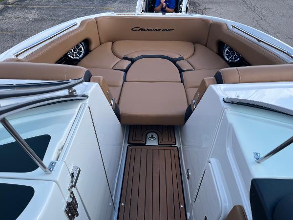 2024 Crownline Eclipse E255 boat interior with tan seating and wood flooring.