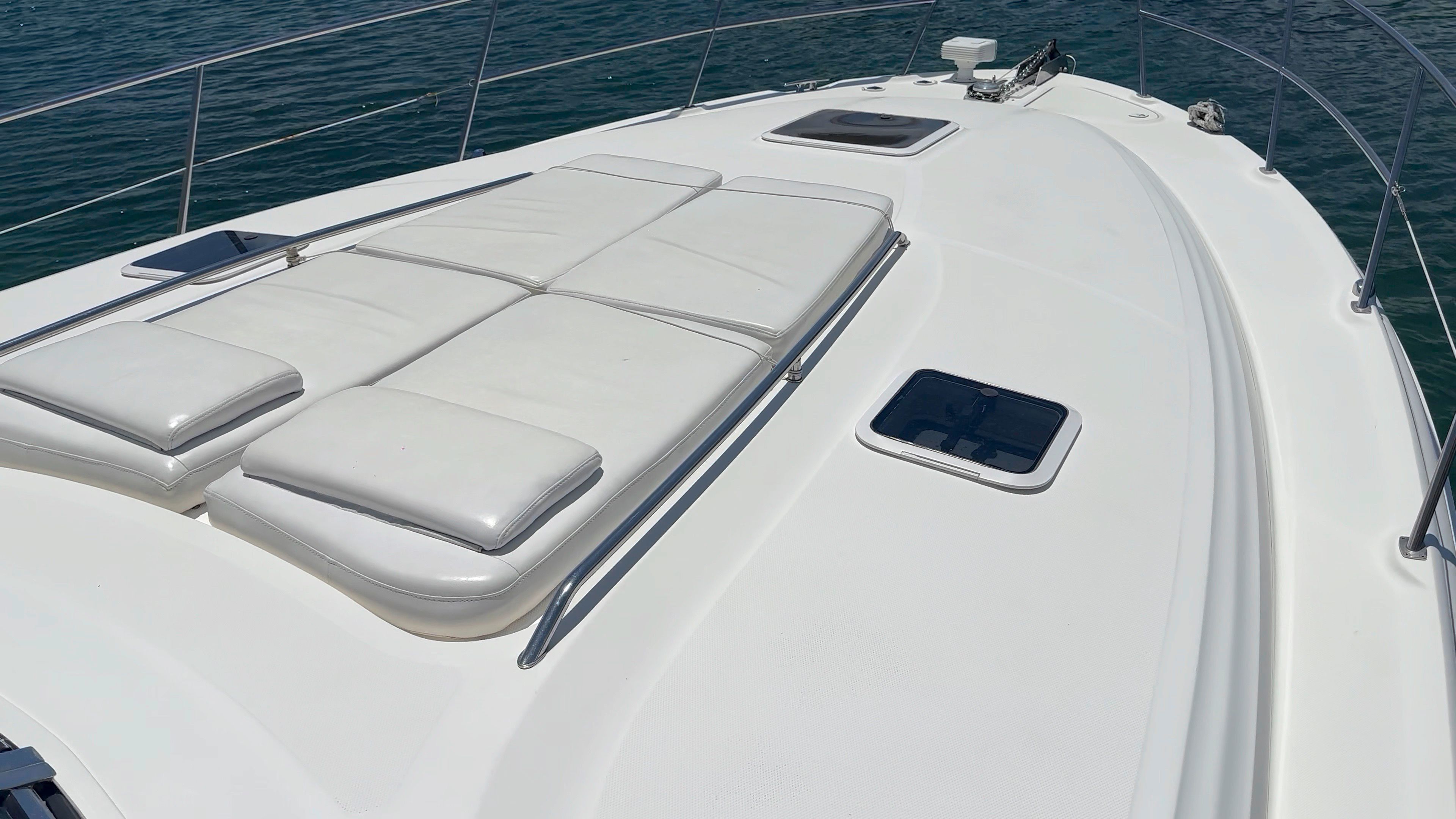 Deck of 2002 Sea Ray 410 Express Cruiser with sun loungers.