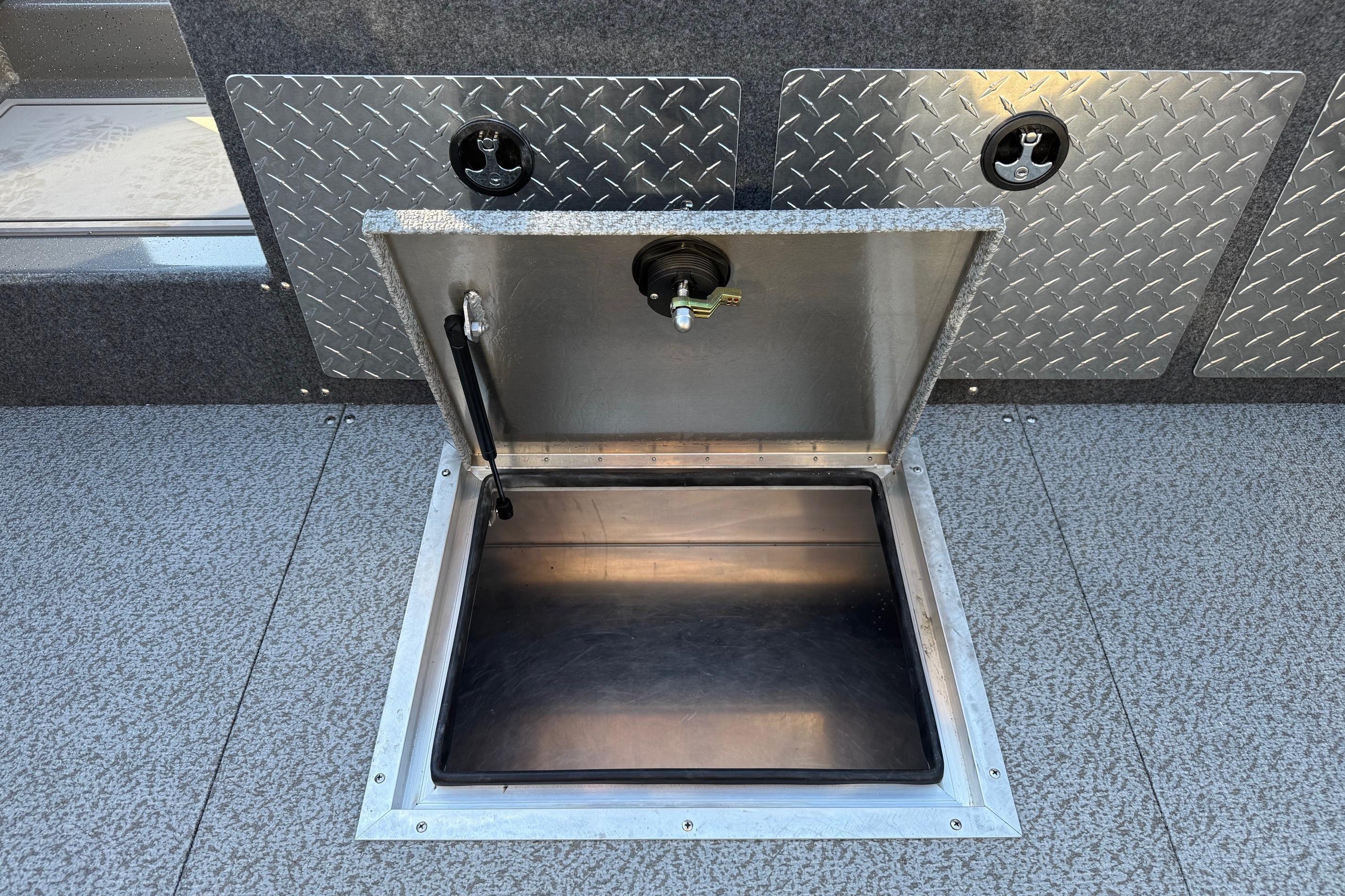 Open storage compartment on 2026 Thunder Jet 200 Luxor boat with diamond plate detailing.