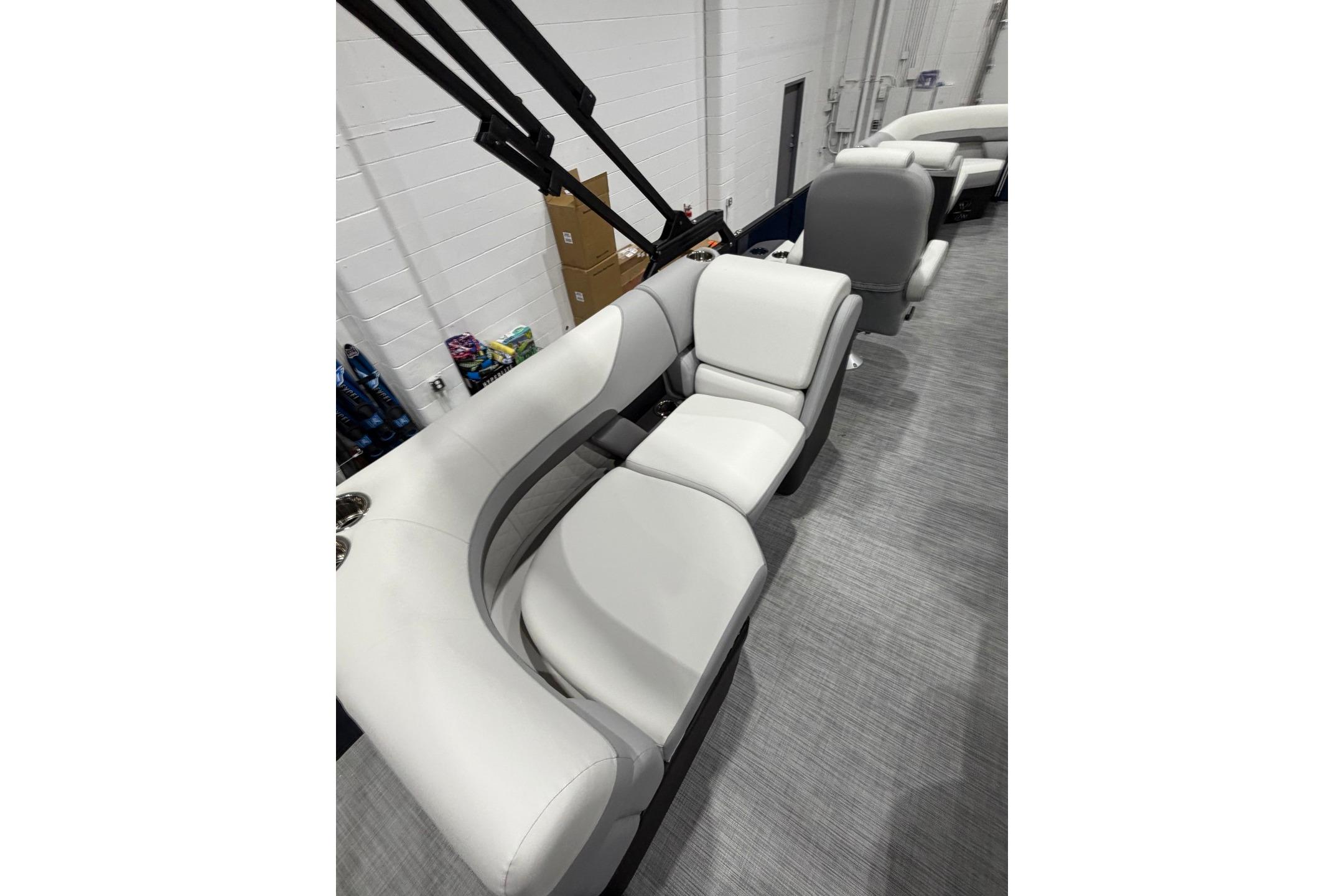 Interior seating of 2026 Lowe SS 230 WT boat, featuring sleek white upholstery.