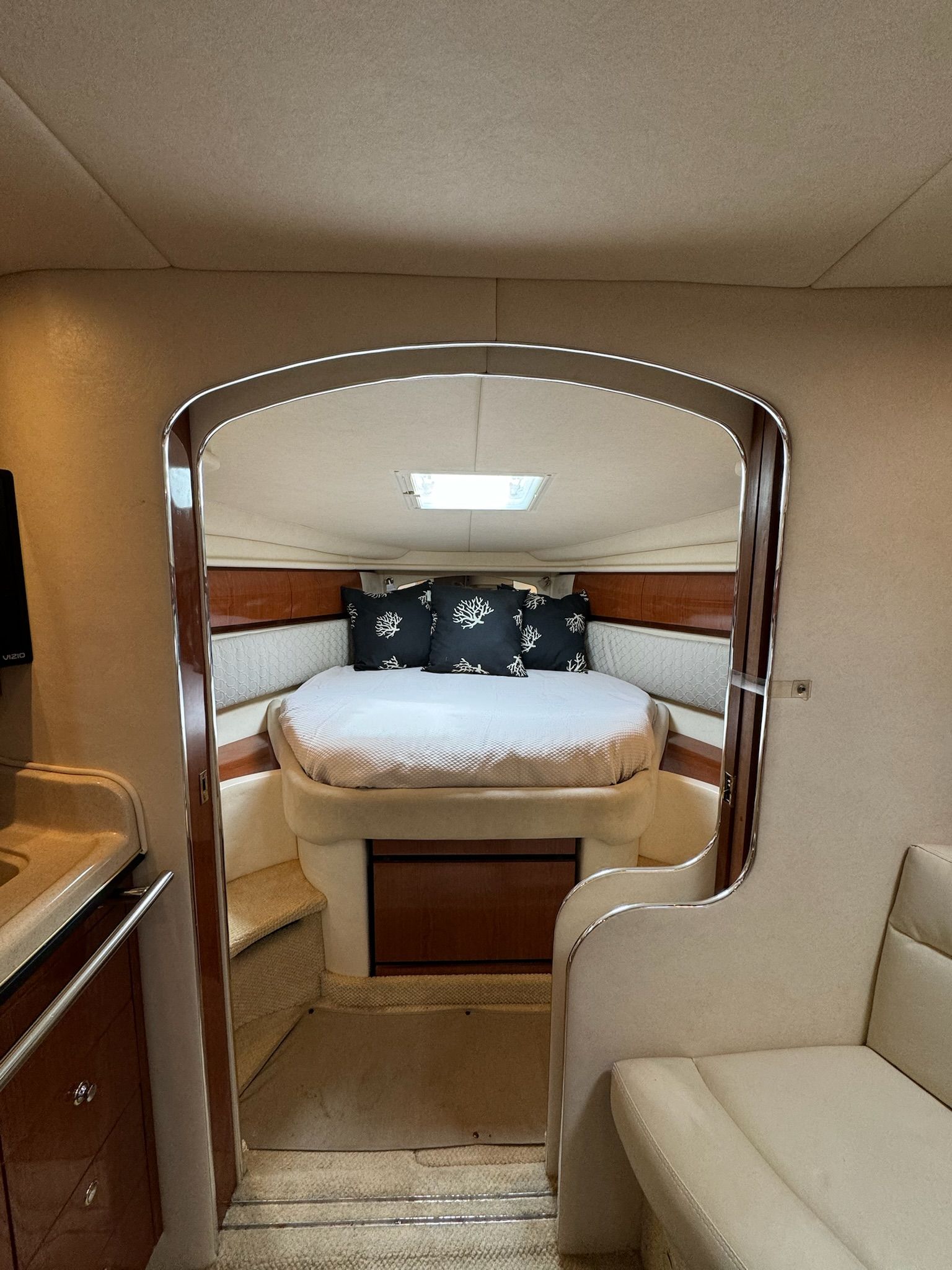 Interior of 2002 Sea Ray 360 Sundancer featuring cozy bedroom.