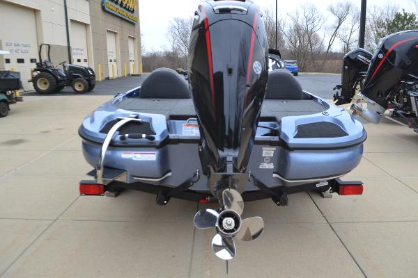 2025 Nitro Z17 boat with powerful outboard motor, parked on concrete surface.
