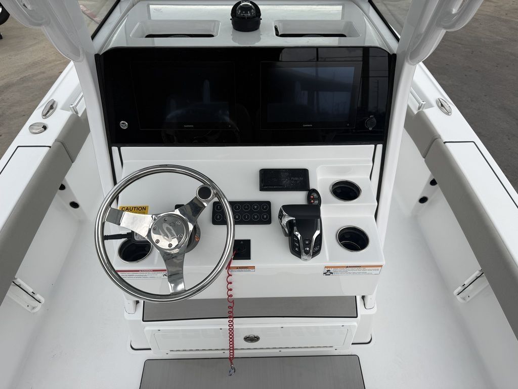 The image shows the helm of a 2025 Sportsman Masters 247OE Bay Boat.