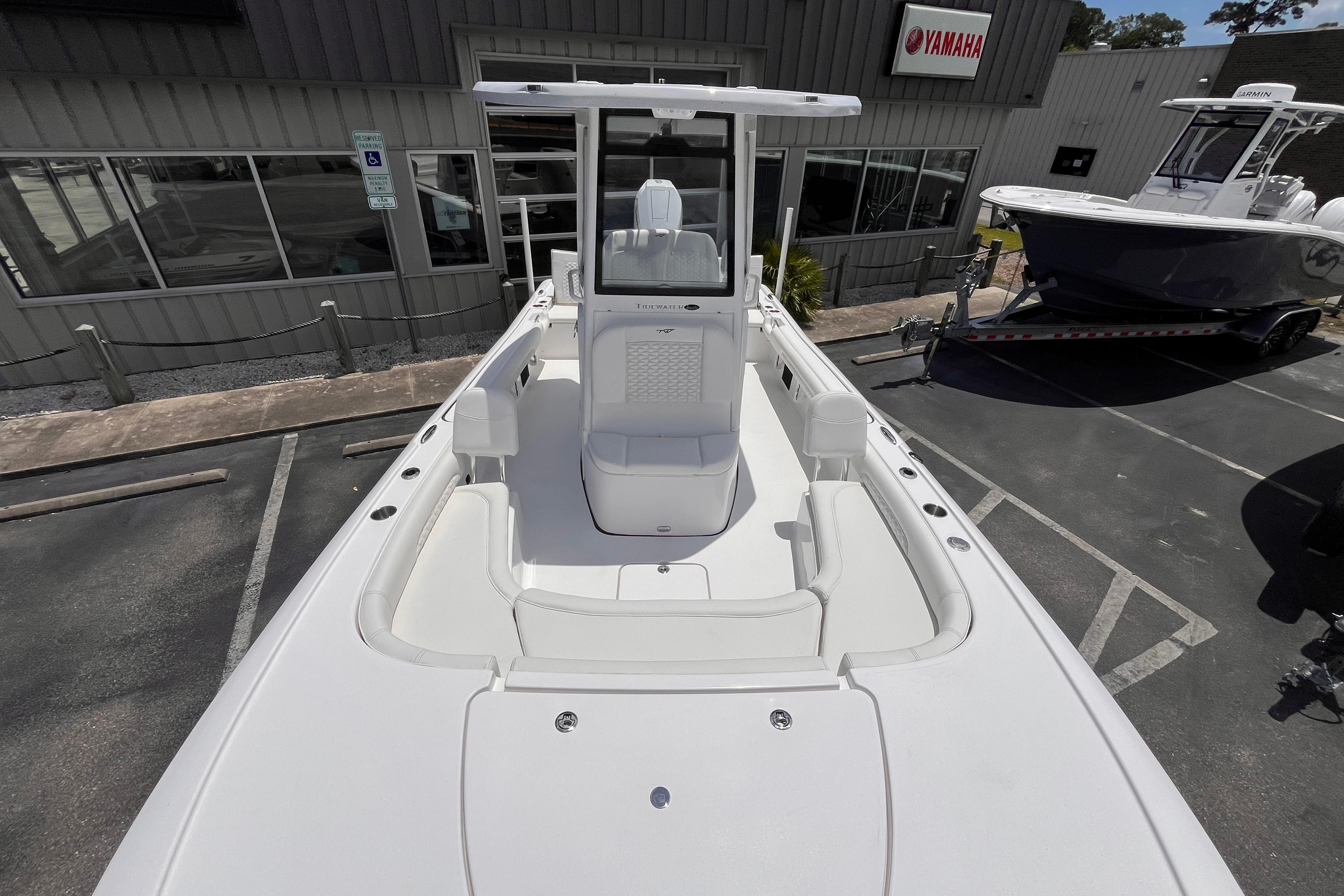 2026 Tidewater 2500 Carolina Bay boat displayed at a dealership with Yamaha signage.