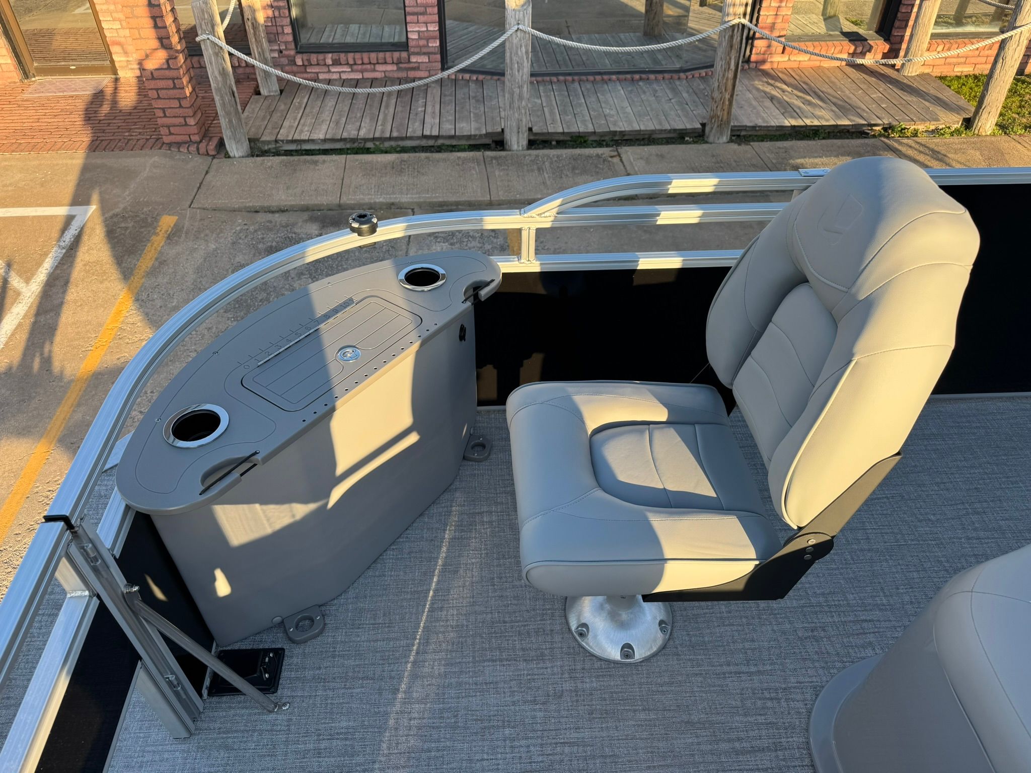 Interior of 2026 Landau Alure 21CC Fish with seat and console.