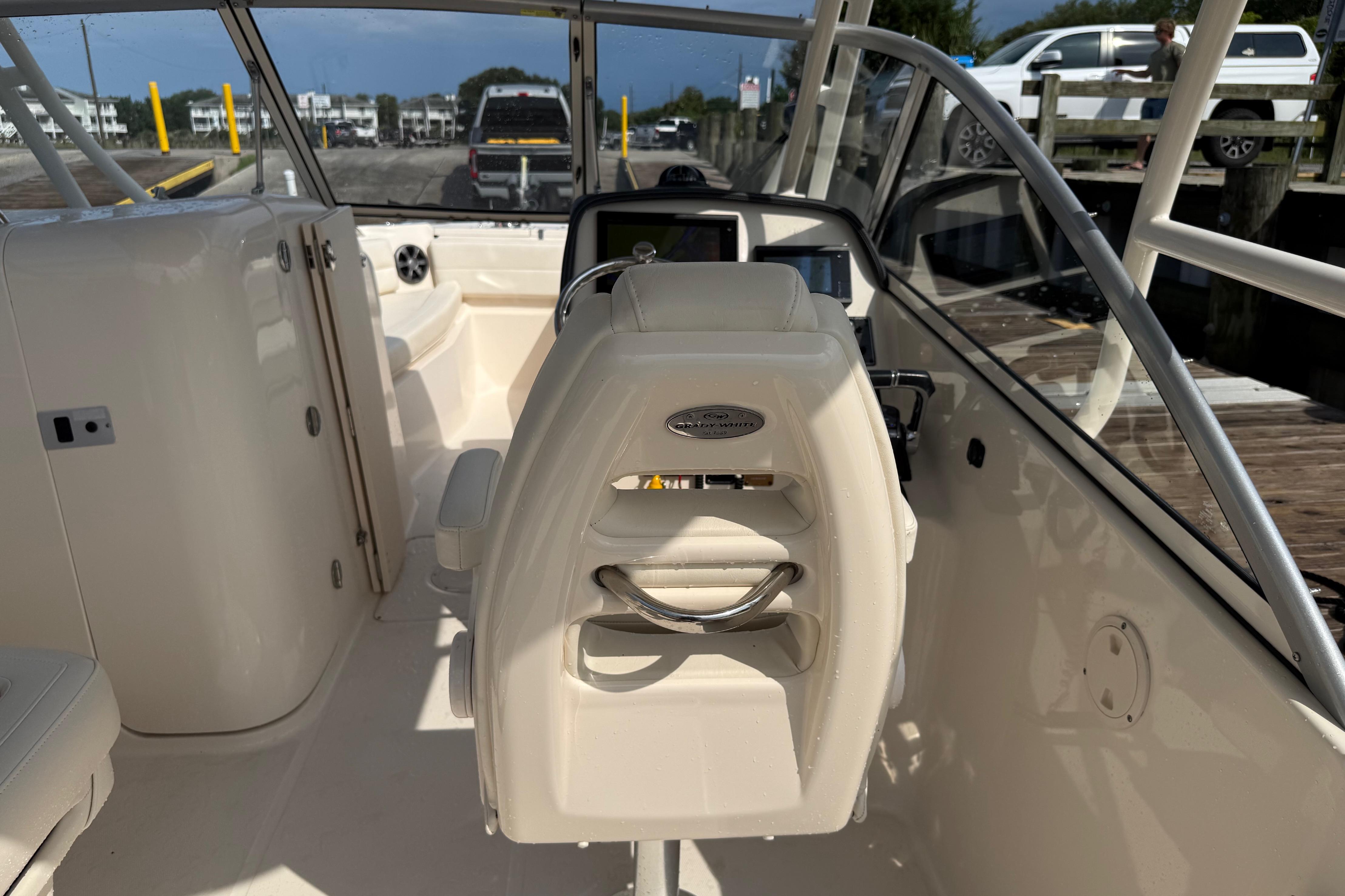 2019 Grady-White Freedom 255 boat interior with helm and seating area.