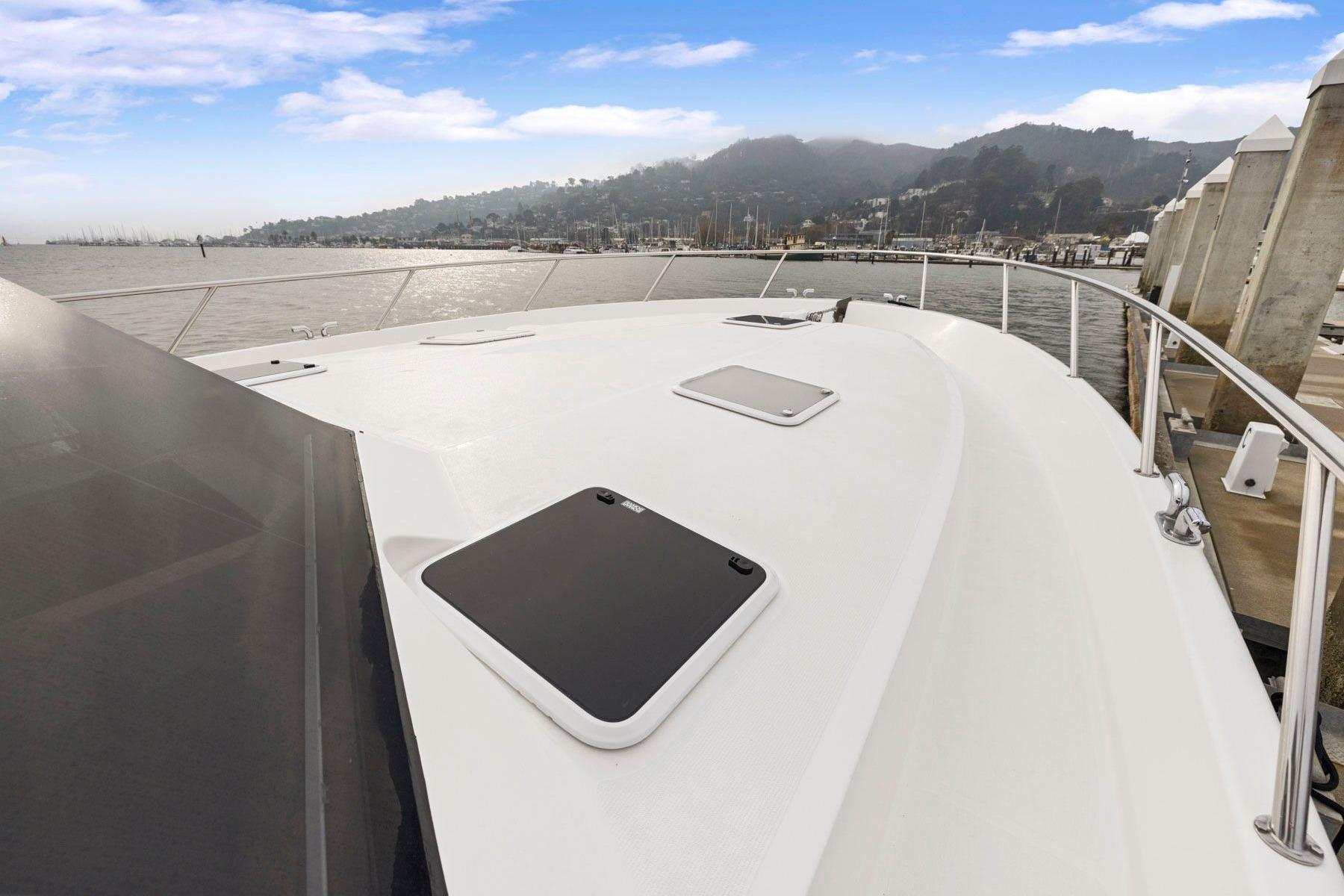 2014 Maritimo M50 yacht deck with scenic harbor view.