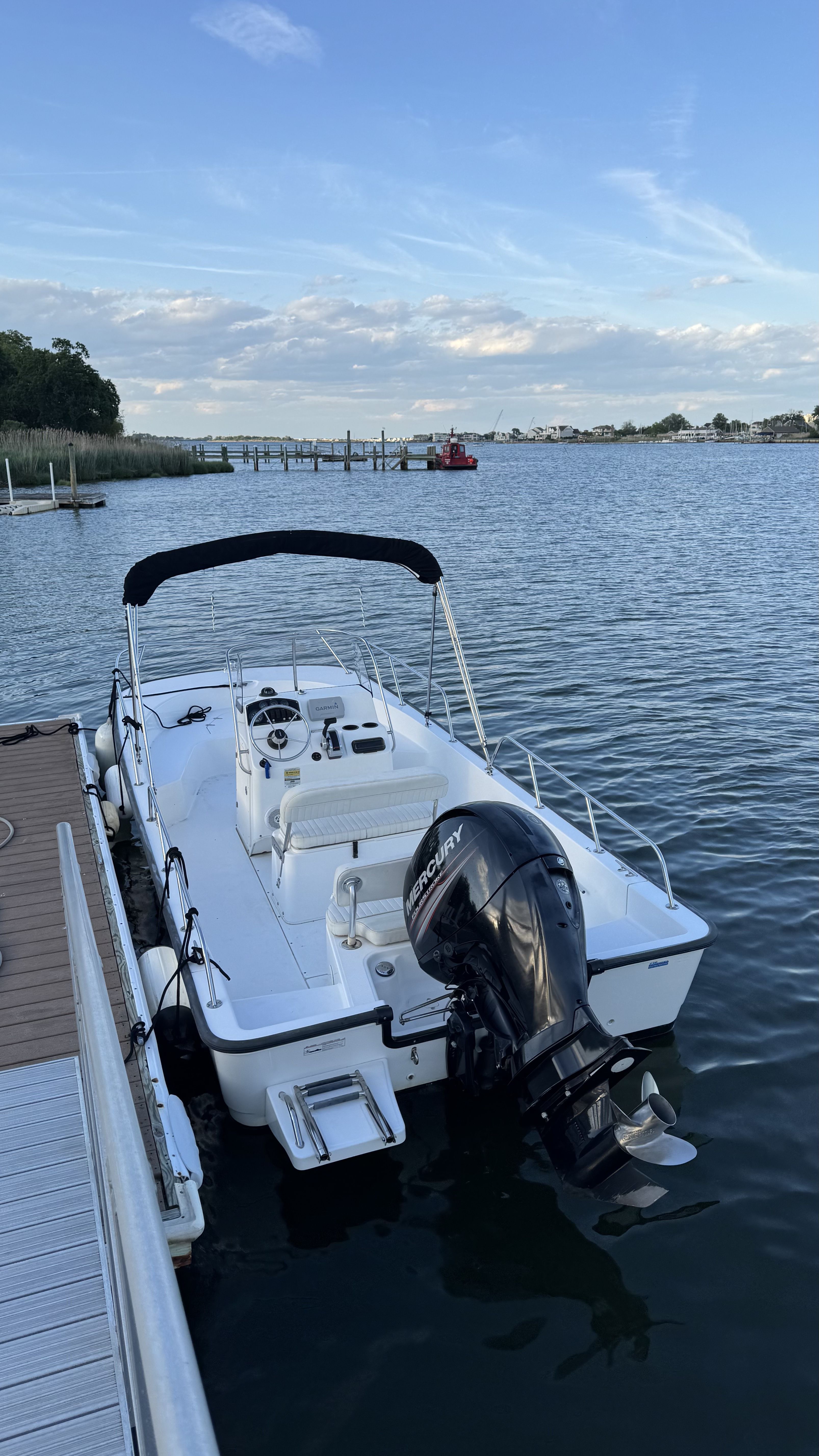 2007 Boston Whaler 190 Montauk boat docked on calm water.
