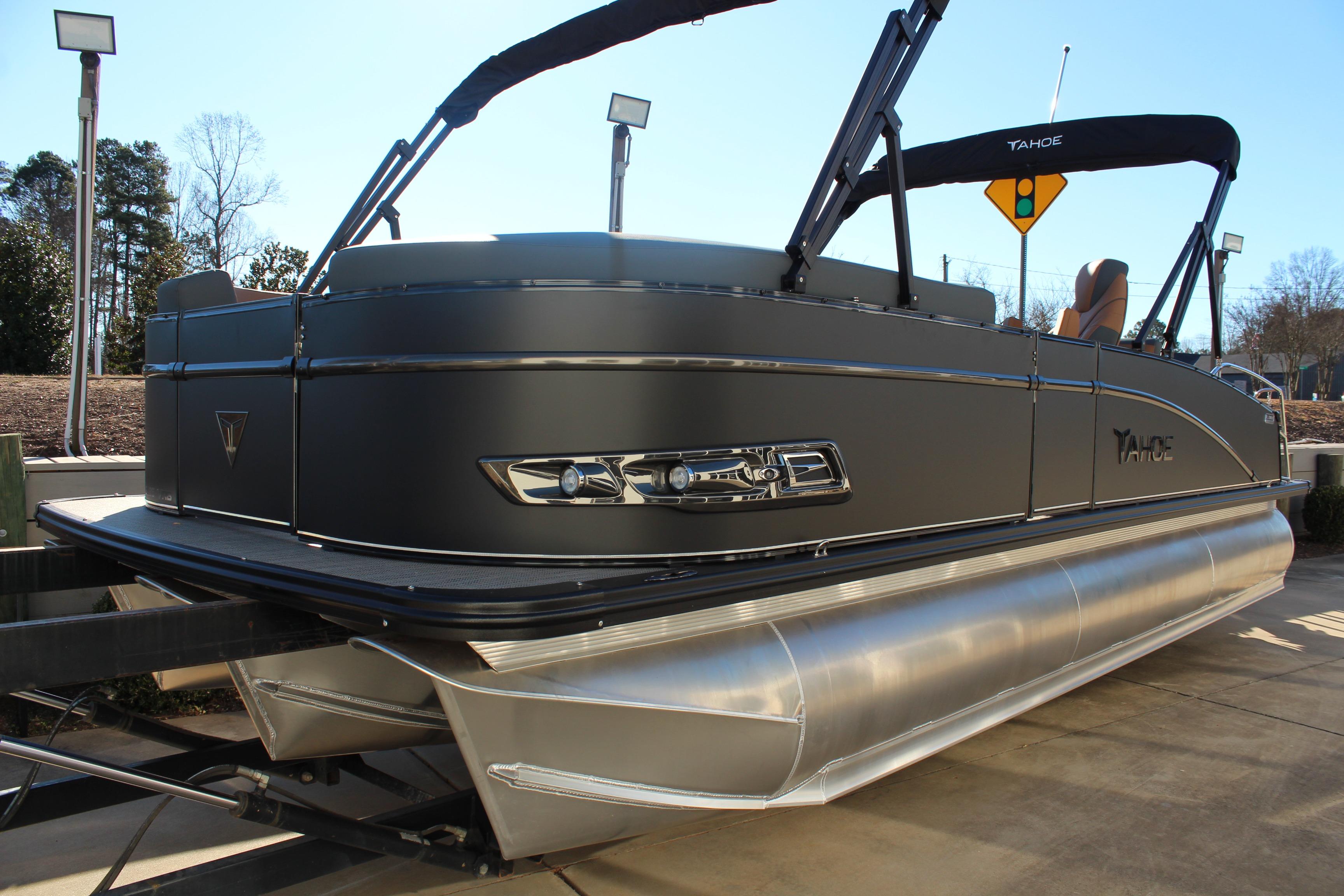2026 Tahoe Pontoon Cascade Versatile Rear Bench, sleek design, docked under clear sky.