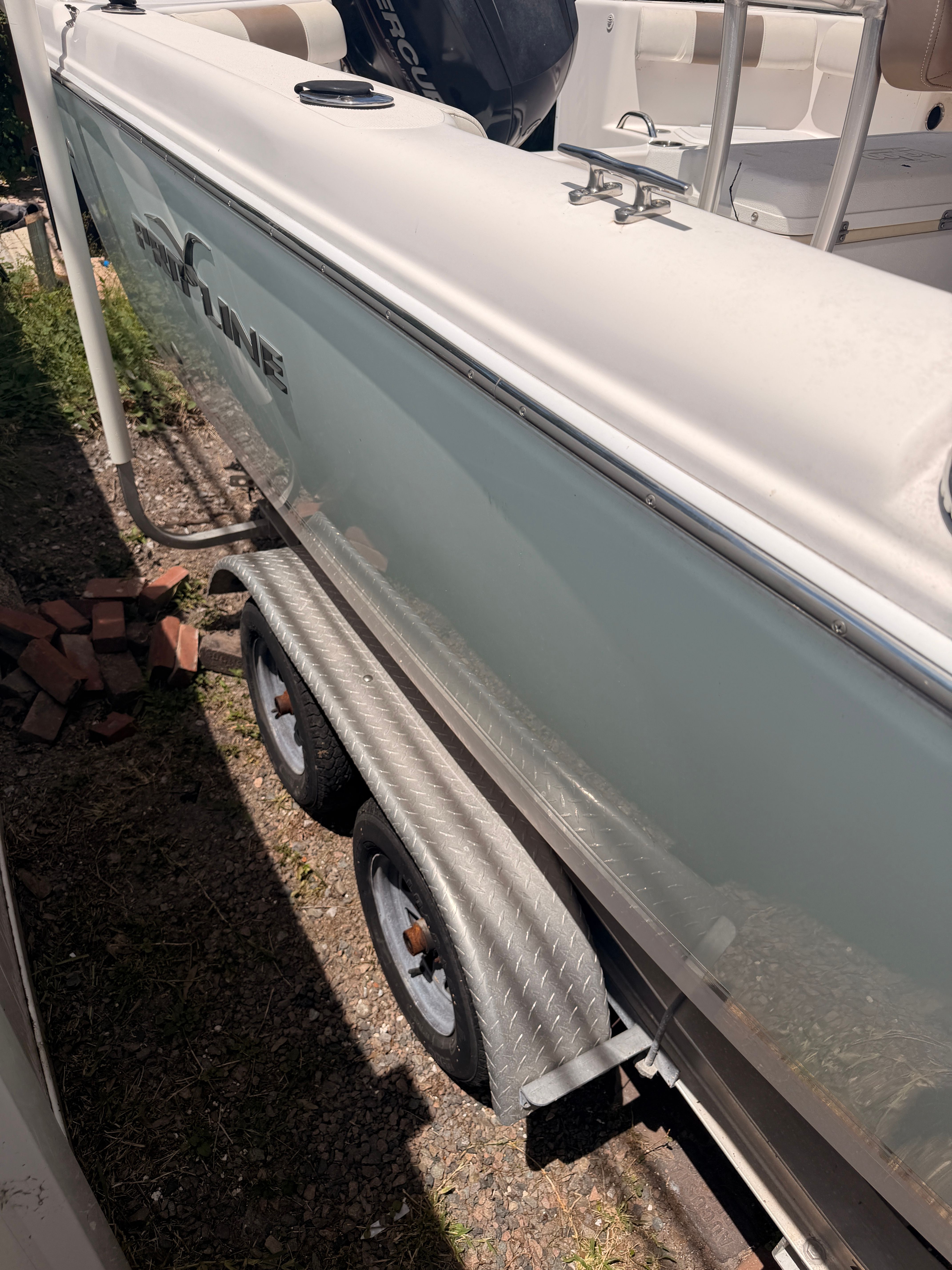 2017 Pro-Line 20 Sport boat on trailer, side view.