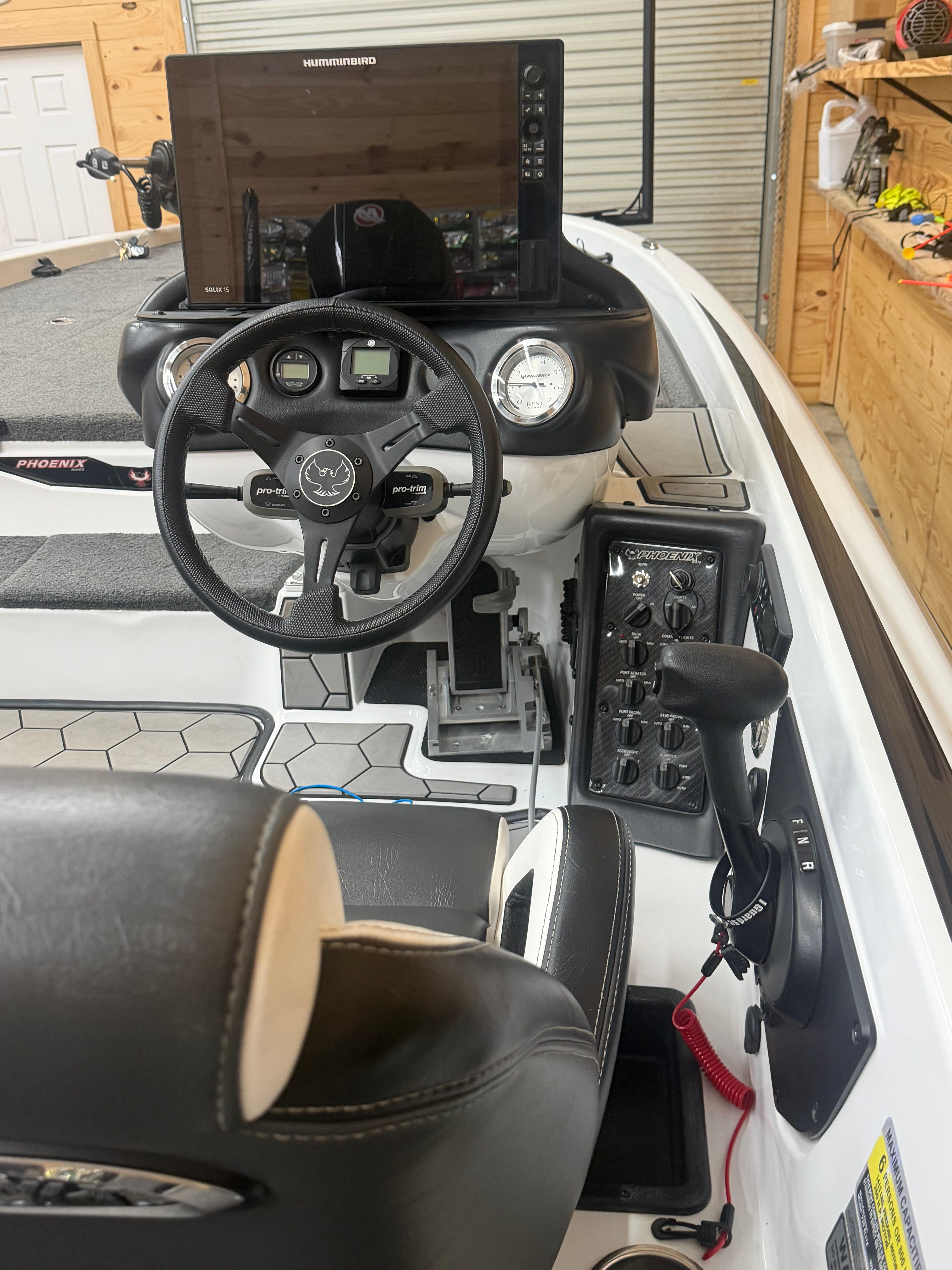 The cockpit of a 2024 Phoenix 920 Elite with steering wheel and electronics.