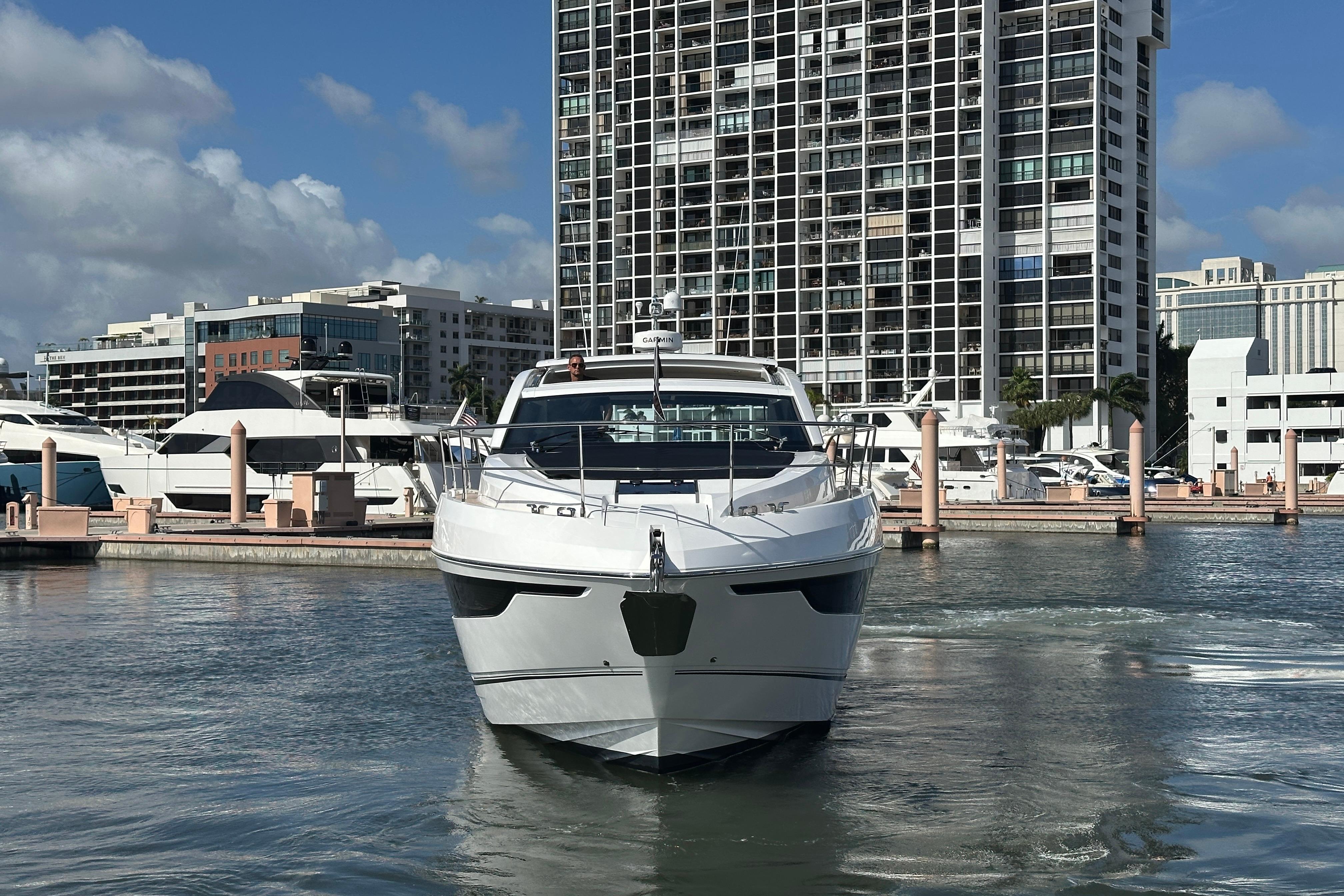 2026 Fairline Targa 47 GT yacht docked in urban marina setting.