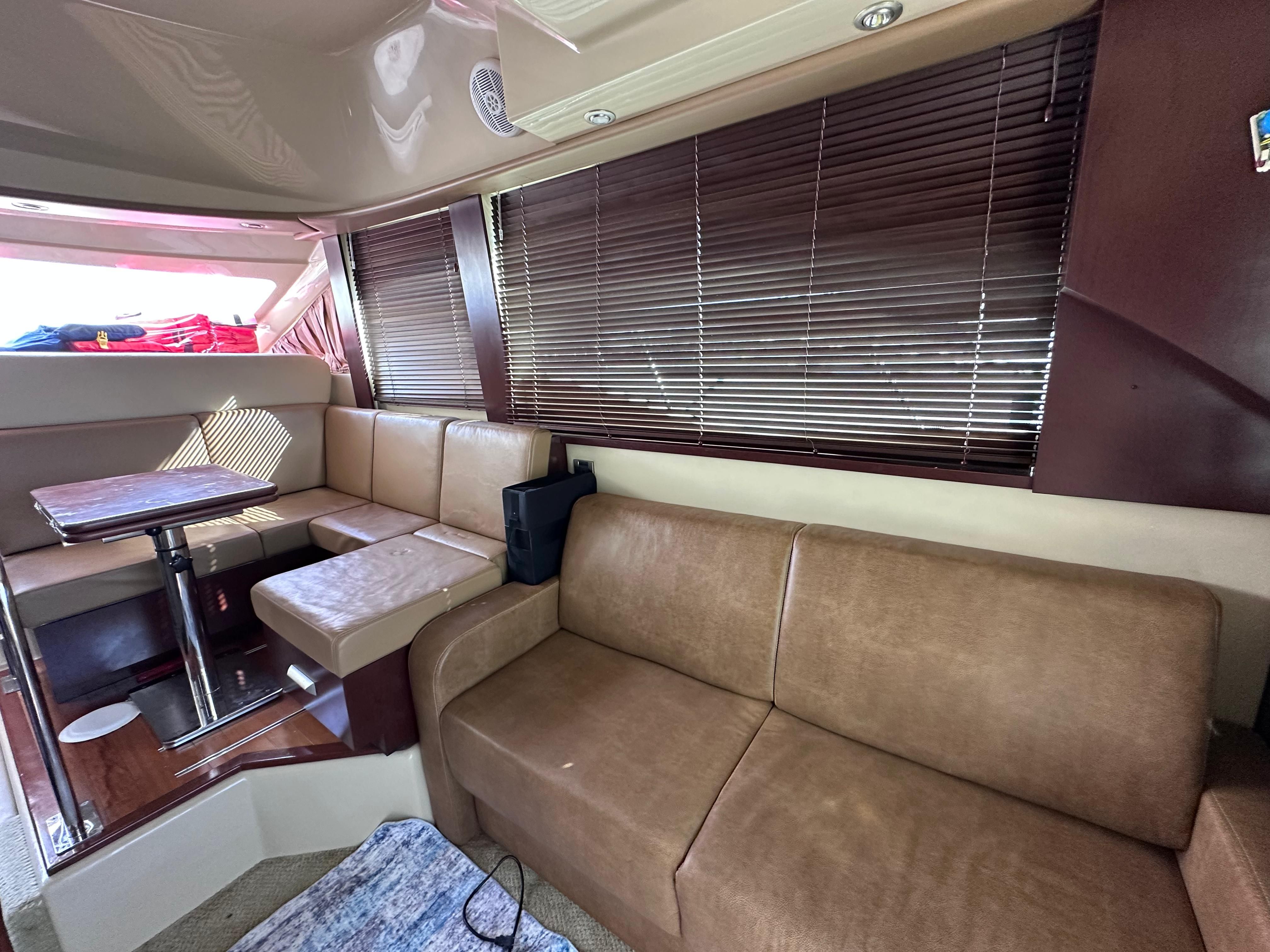 Interior of 2007 Sea Ray 36 Sedan Bridge with leather sofas.