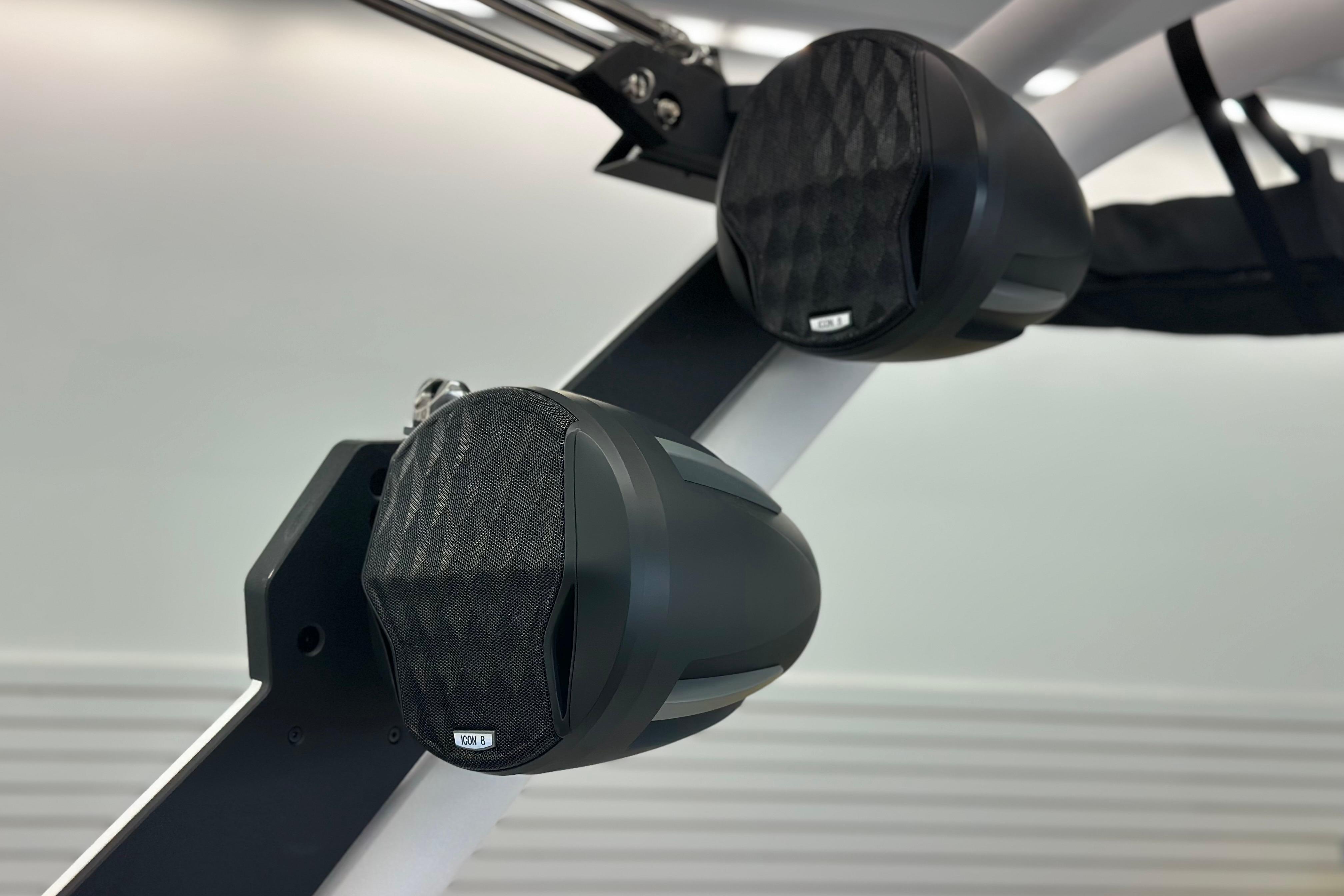 2026 Malibu Wakesetter 25 LSV boat speakers, sleek design, mounted on a white frame.