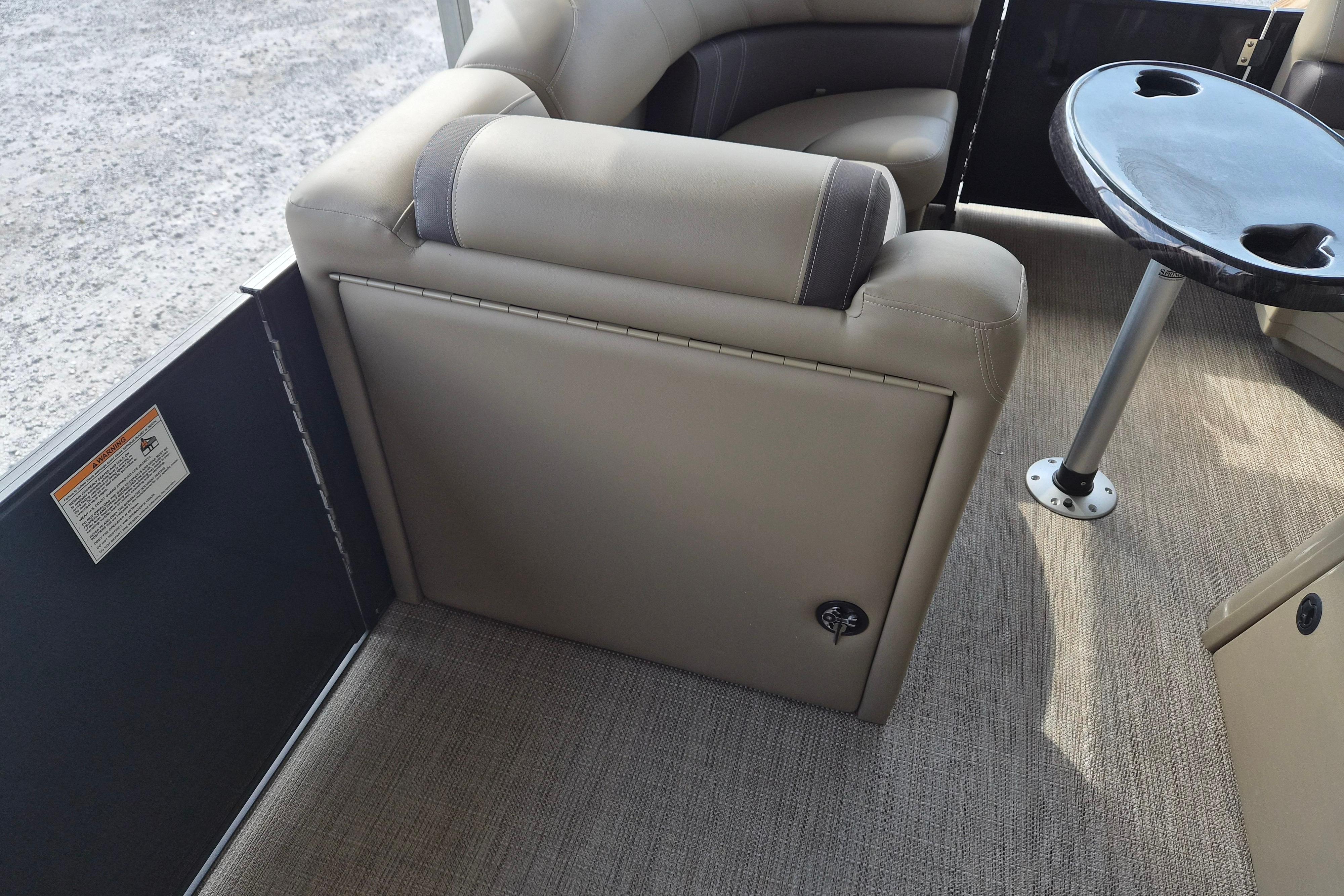 2026 Sylvan Mirage 820 CLZ DH interior with beige seating and round table.