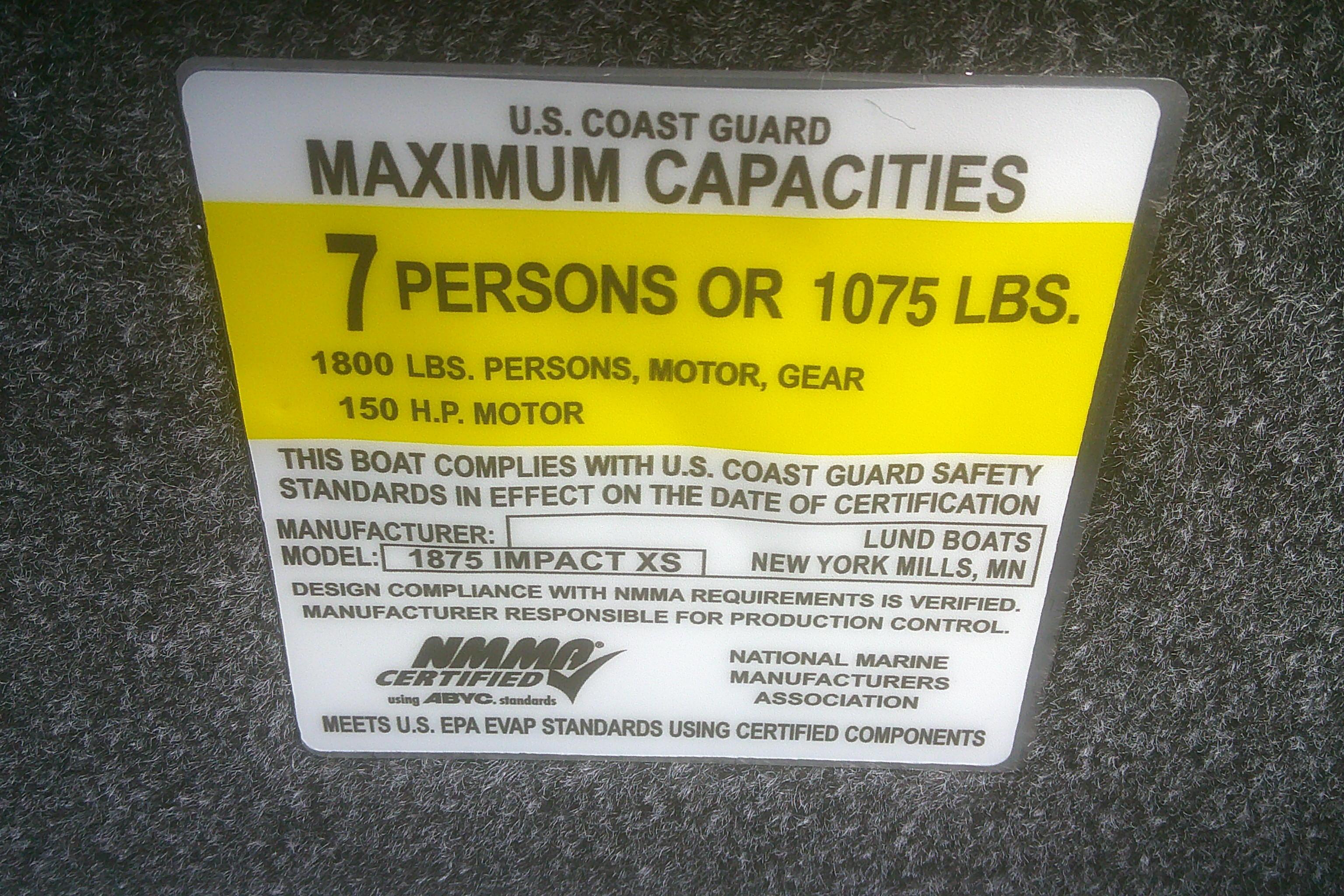 2026 Lund 1875 Impact XS SS boat capacity label, 7 persons or 1075 lbs, USCG certified.