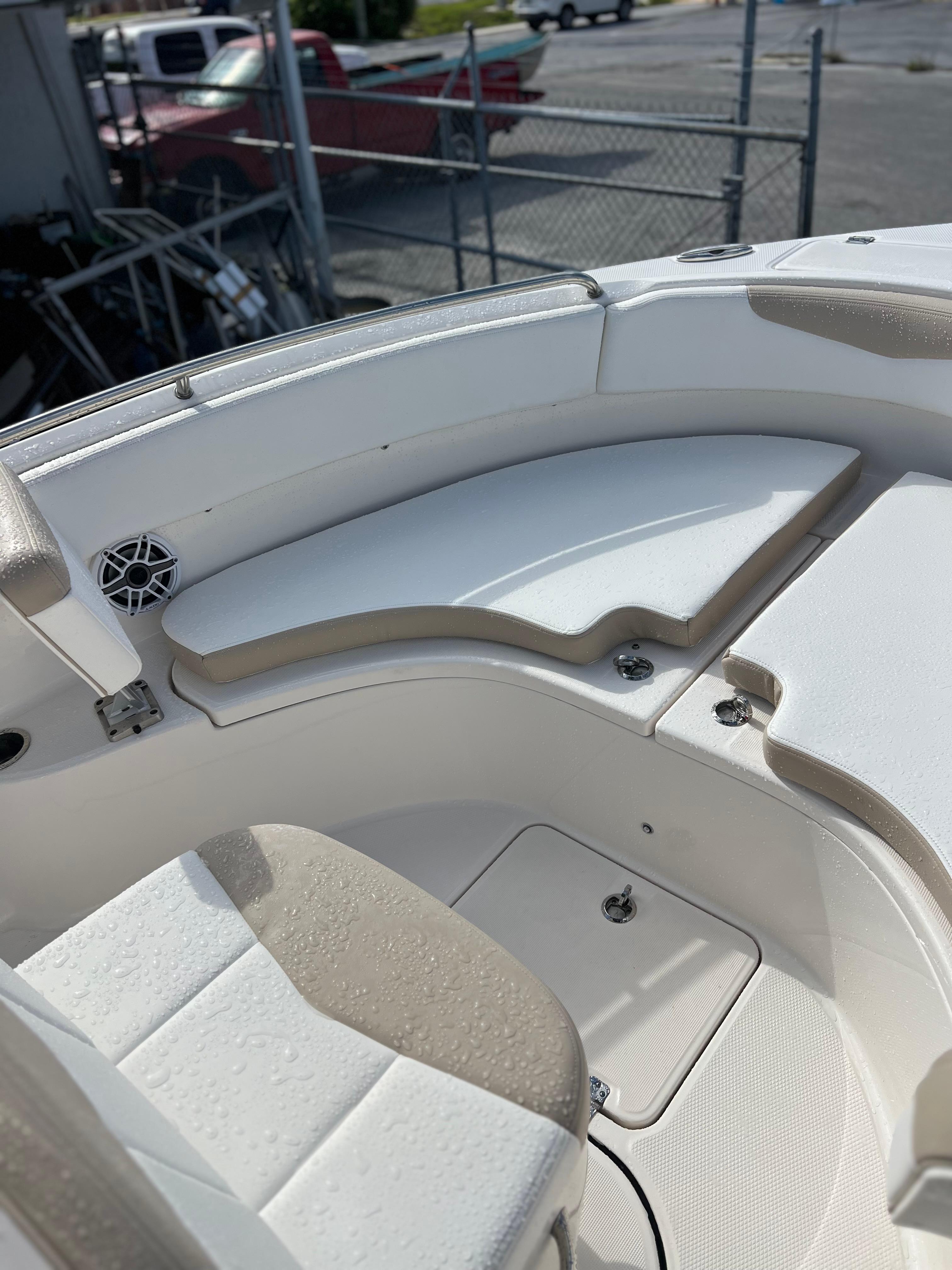 2022 Robalo R222 Center Console boat interior with cushioned seating and storage compartments.