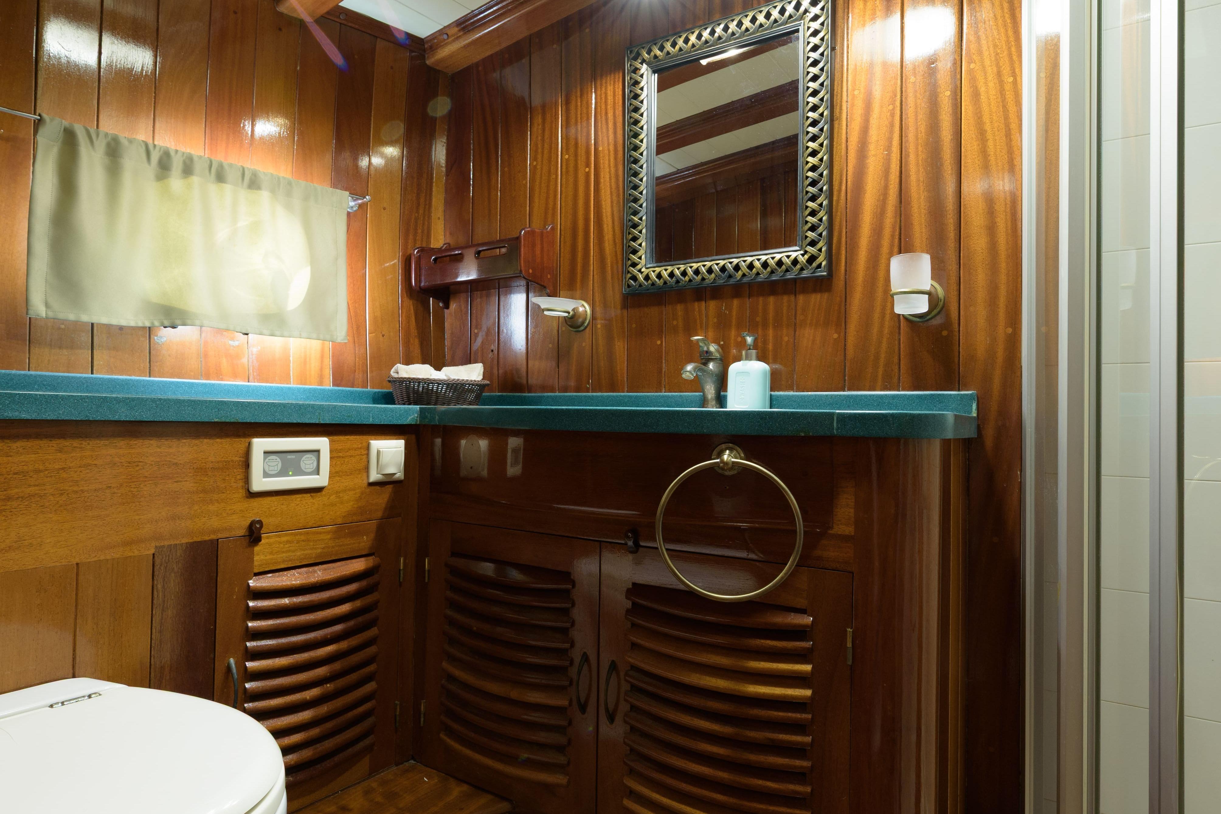 Luxurious wooden bathroom interior on a 2004 Su Marine Gulet yacht.