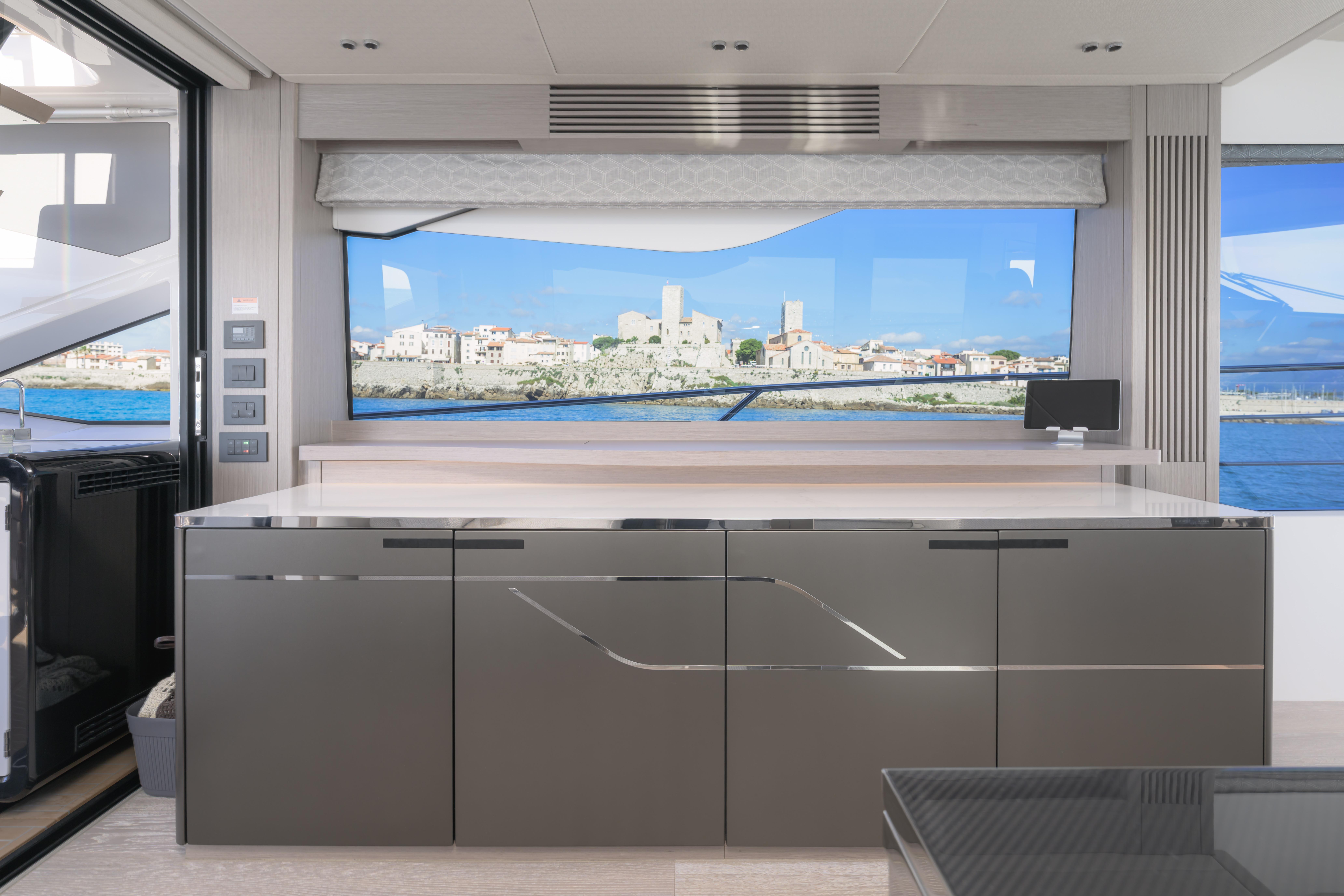 Luxurious interior of 2024 Sunseeker 75 Sport Yacht with scenic ocean view.
