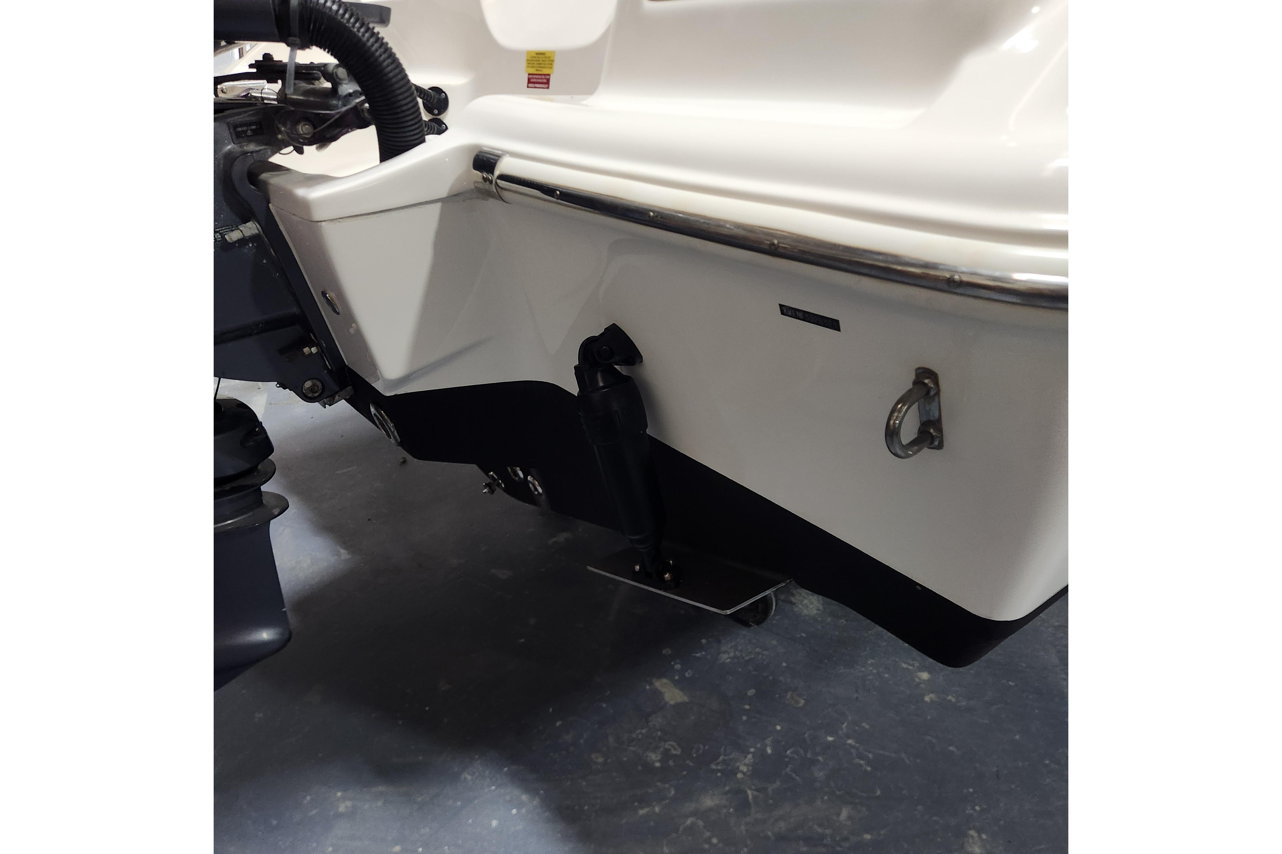 2023 Key West 219 FS boat transom detail with motor and hardware.