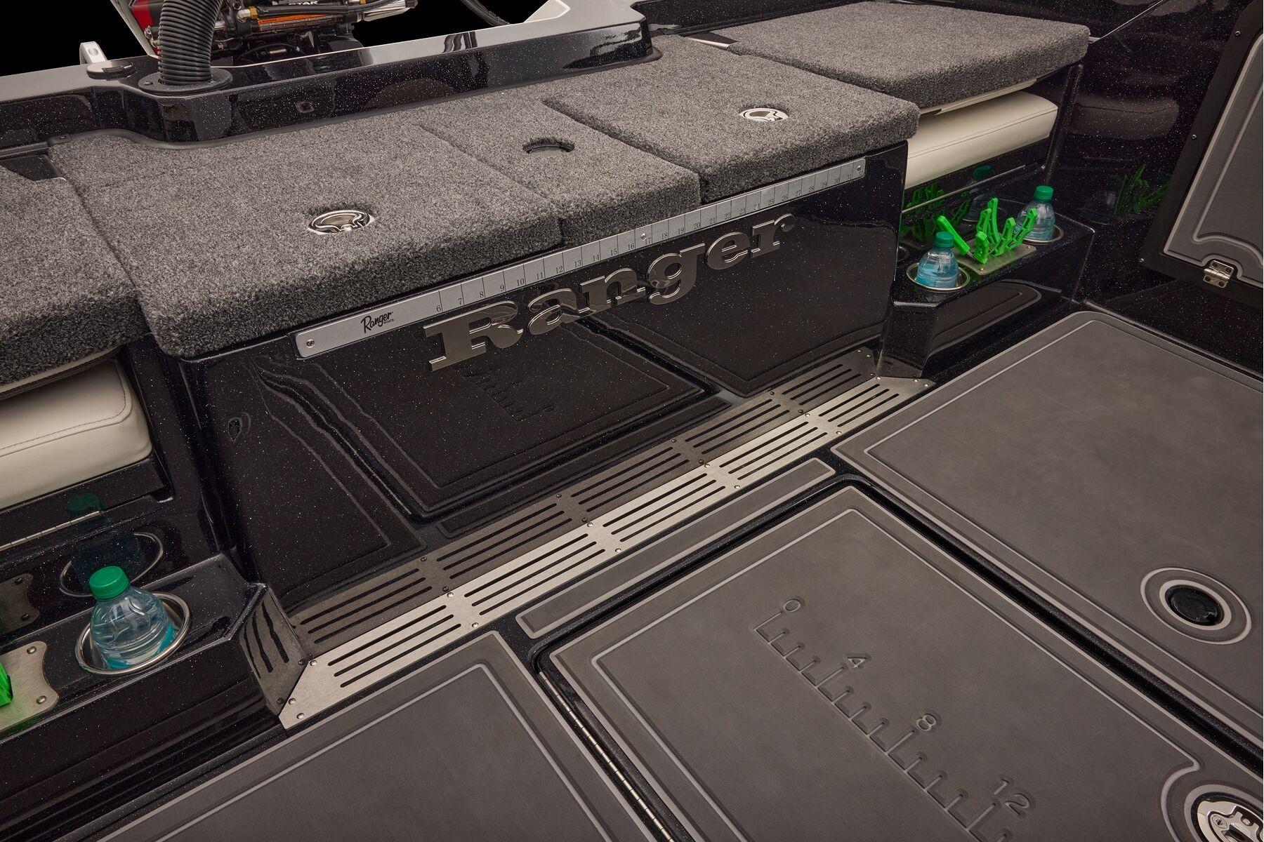 Manufacturer Provided Image: 2026 Ranger 620xFS Pro boat interior with storage, cup holders, and measuring ruler.