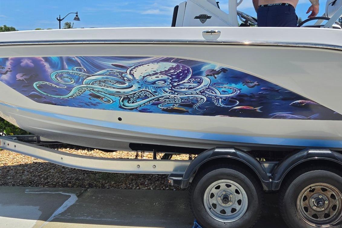 2024 Yamaha Boats 222 FSH Sport E with vibrant octopus marine artwork on the hull.