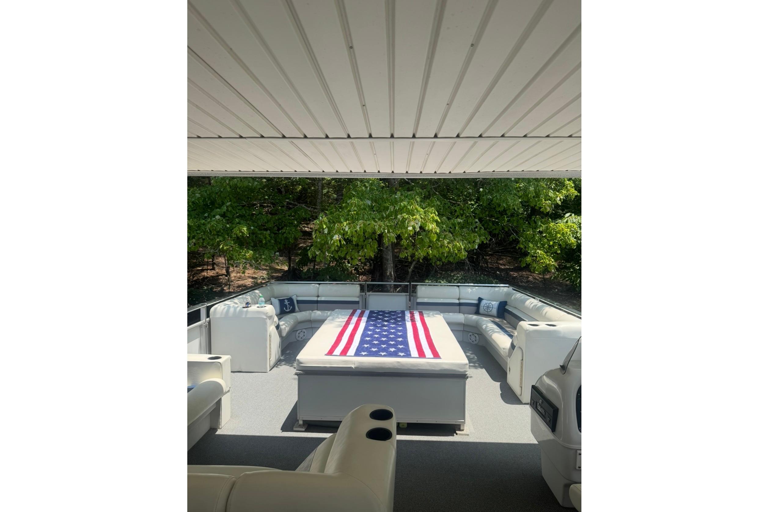 Spacious deck of 2008 Destination Yachts 45X14 with American flag decor.