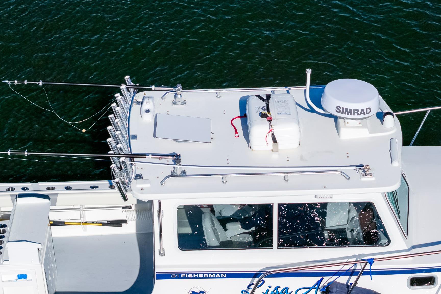 2024 Steiger Craft 31 Fisherman boat with fishing rods and Simrad equipment on deck.