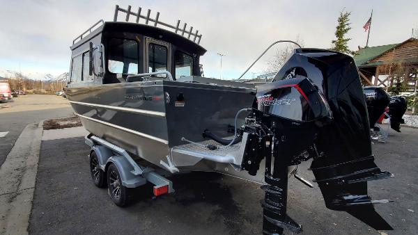 2023 Spartan 220 Maximus boat with powerful outboard motor on trailer.