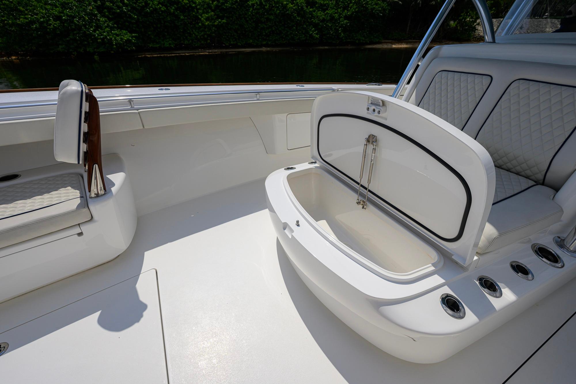 2020 Valhalla Boatworks V-41 interior with open storage compartment and cushioned seating.