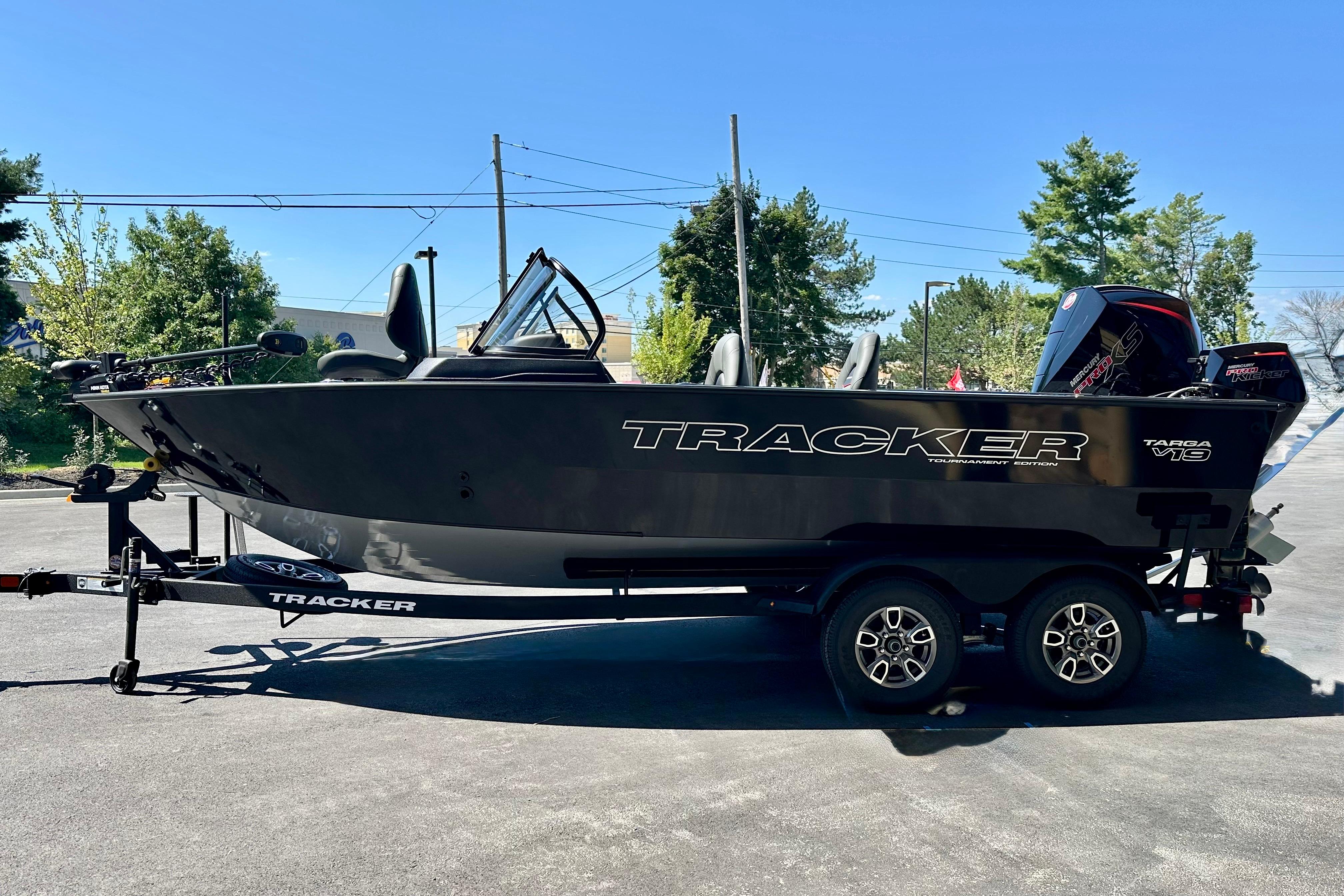 2026 Tracker Targa V-19 WT boat on trailer, parked outdoors.