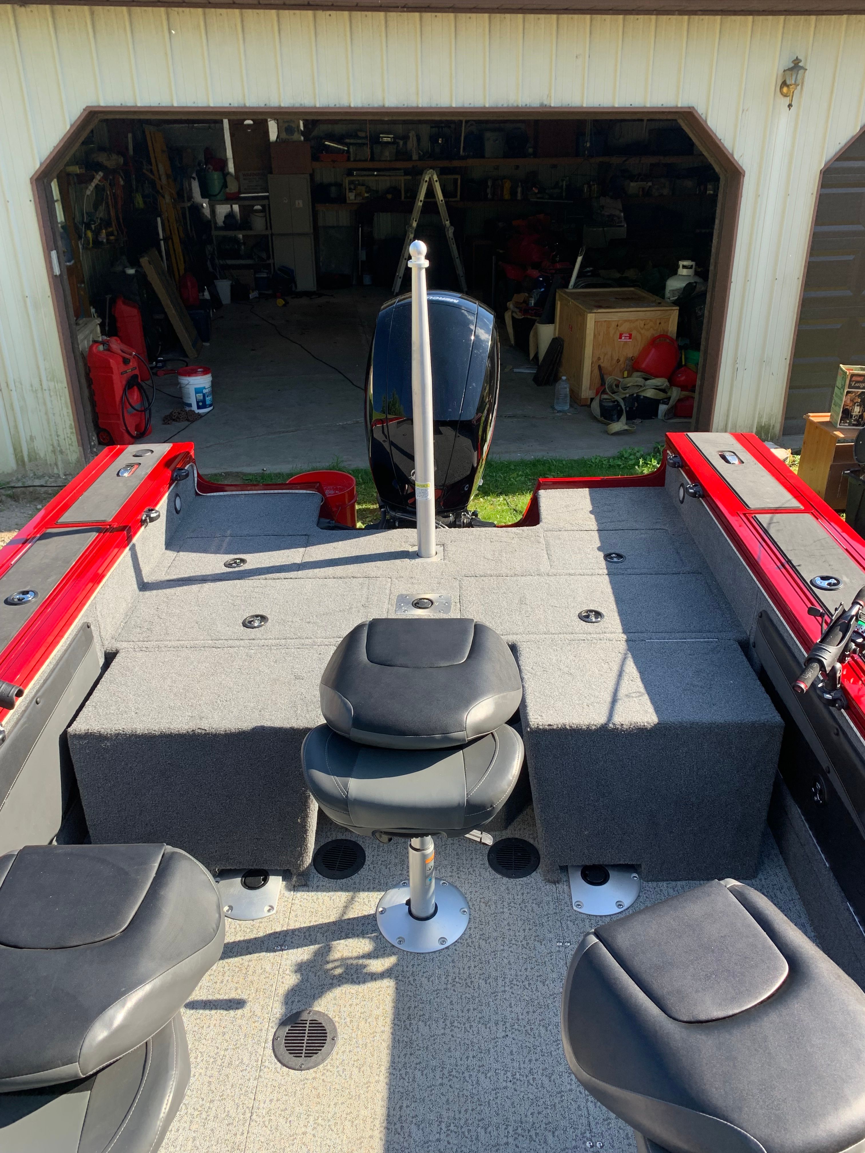 Interior view of a 2022 Tracker Targa V-19 WT boat in a garage.