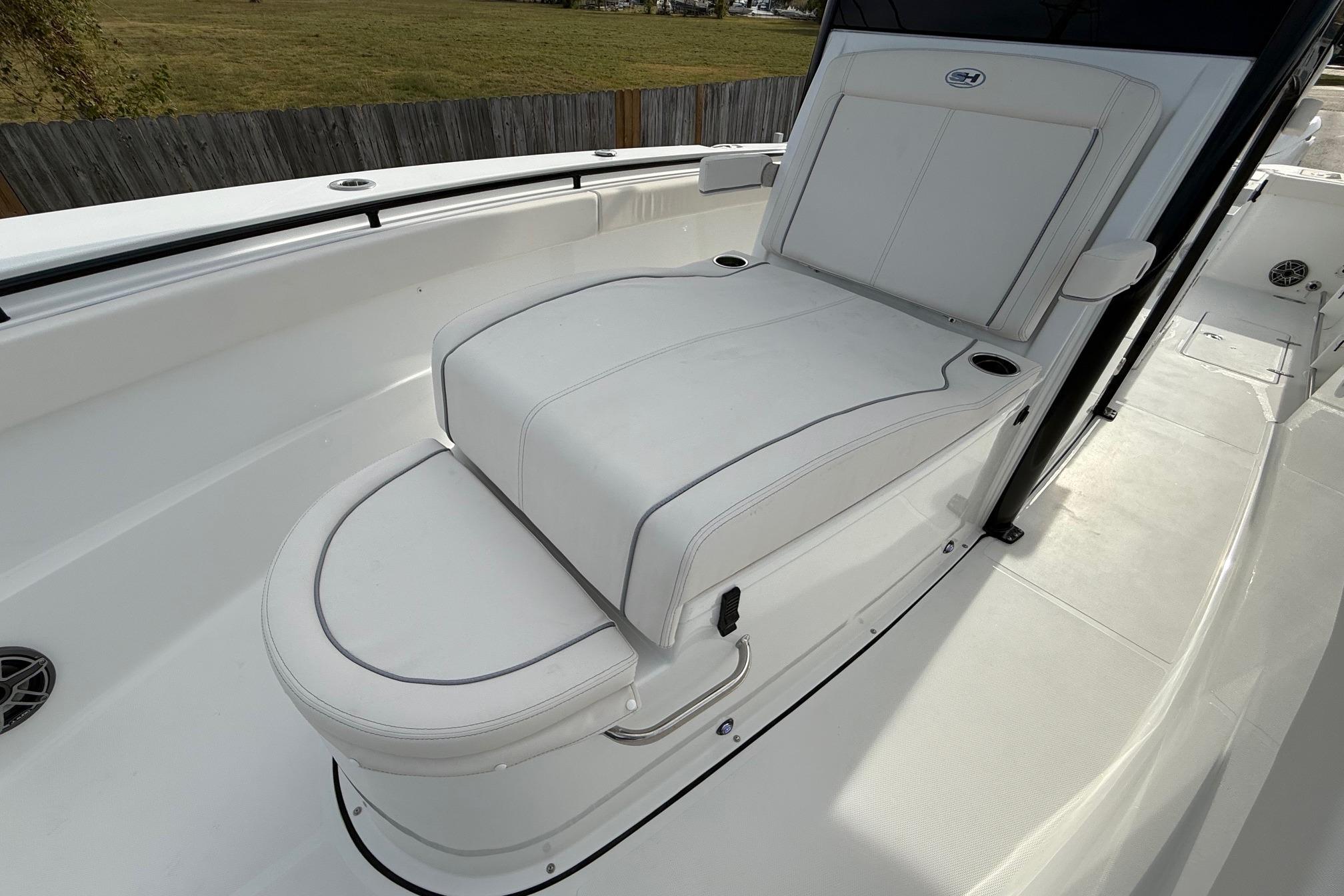 2026 Sea Hunt Gamefish 30 Coffin Box boat with white cushioned seating.