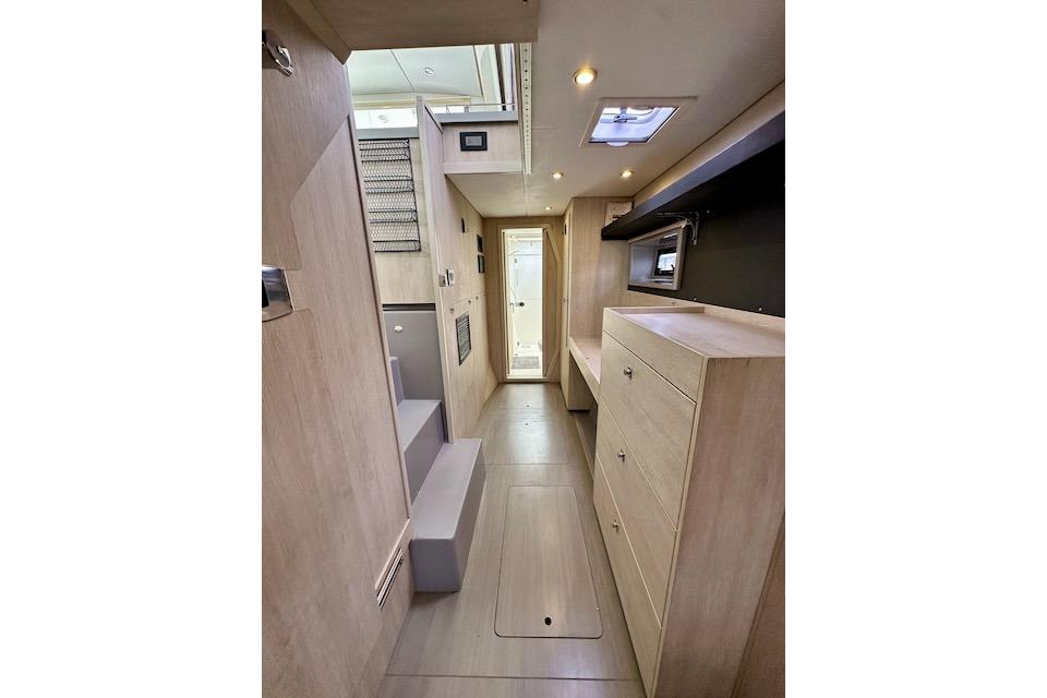 Interior of 2017 Leopard 40 yacht, featuring modern wood cabinetry and sleek design.