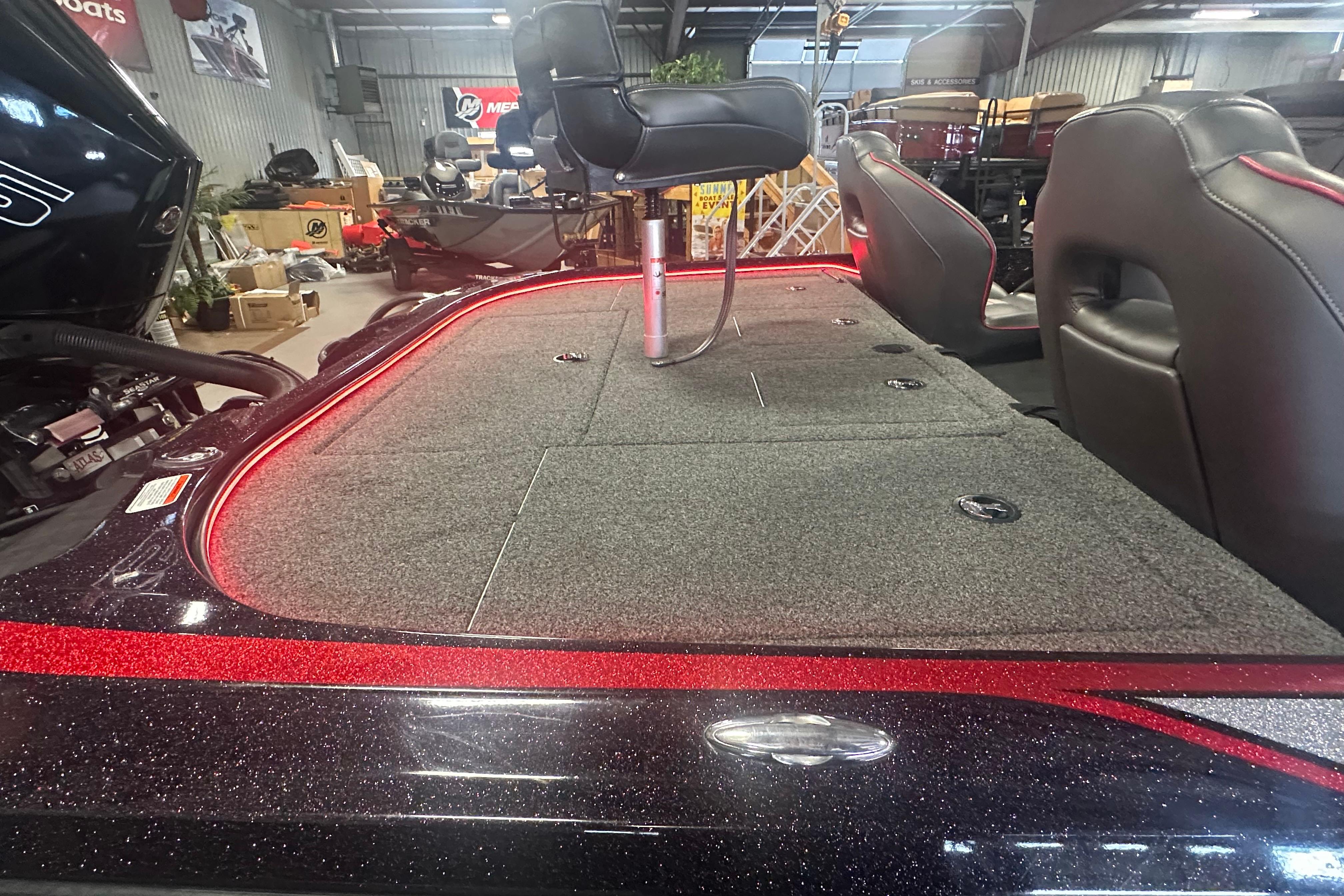 2022 Nitro Z20 Pro boat interior with seating and storage compartments in showroom.
