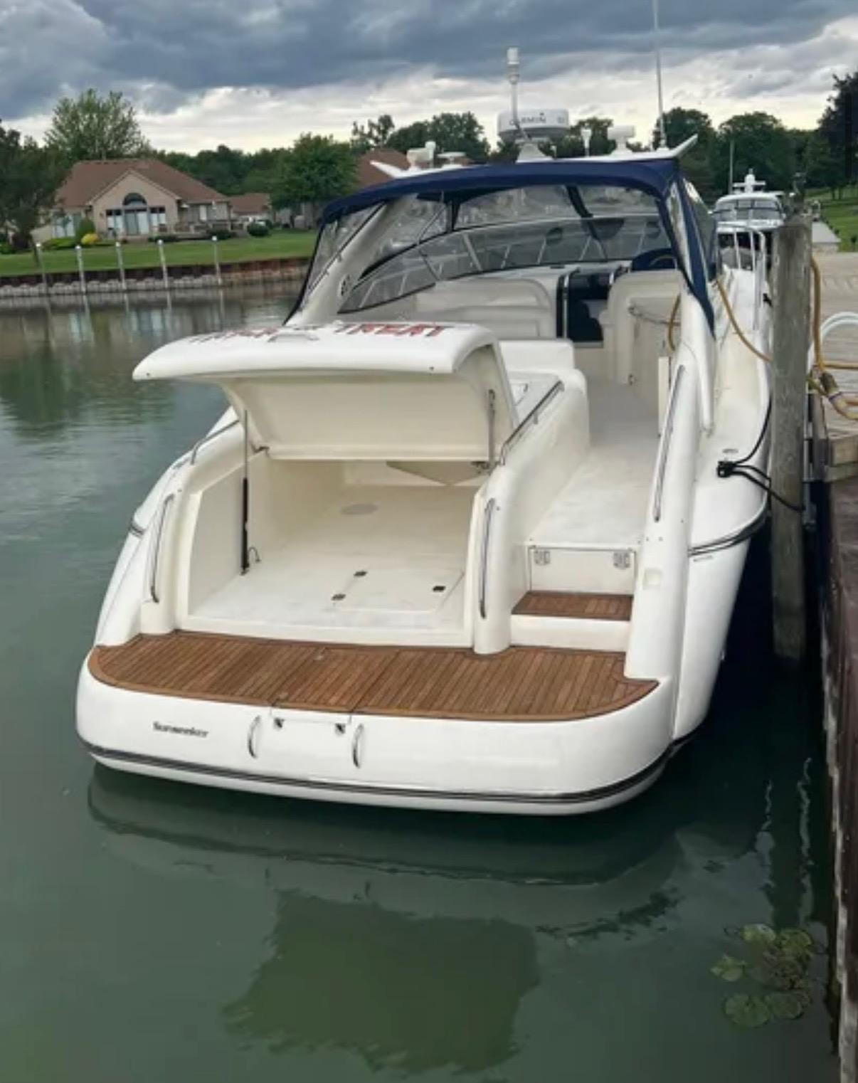 1997 Sunseeker Camargue 47 yacht docked, featuring open deck and sleek design.