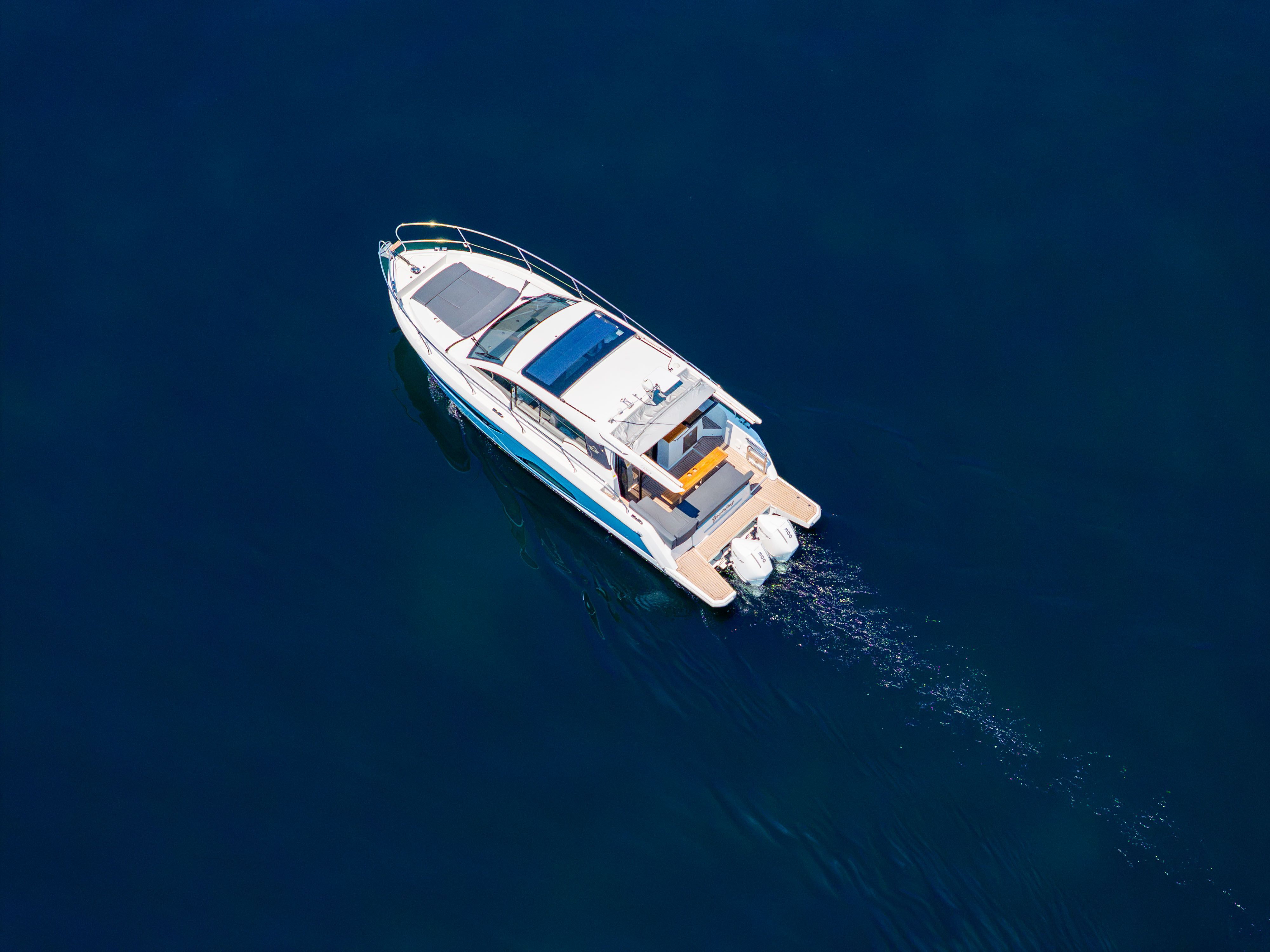 2023 Sealine C335V on calm water, featuring a sleek design and spacious deck.