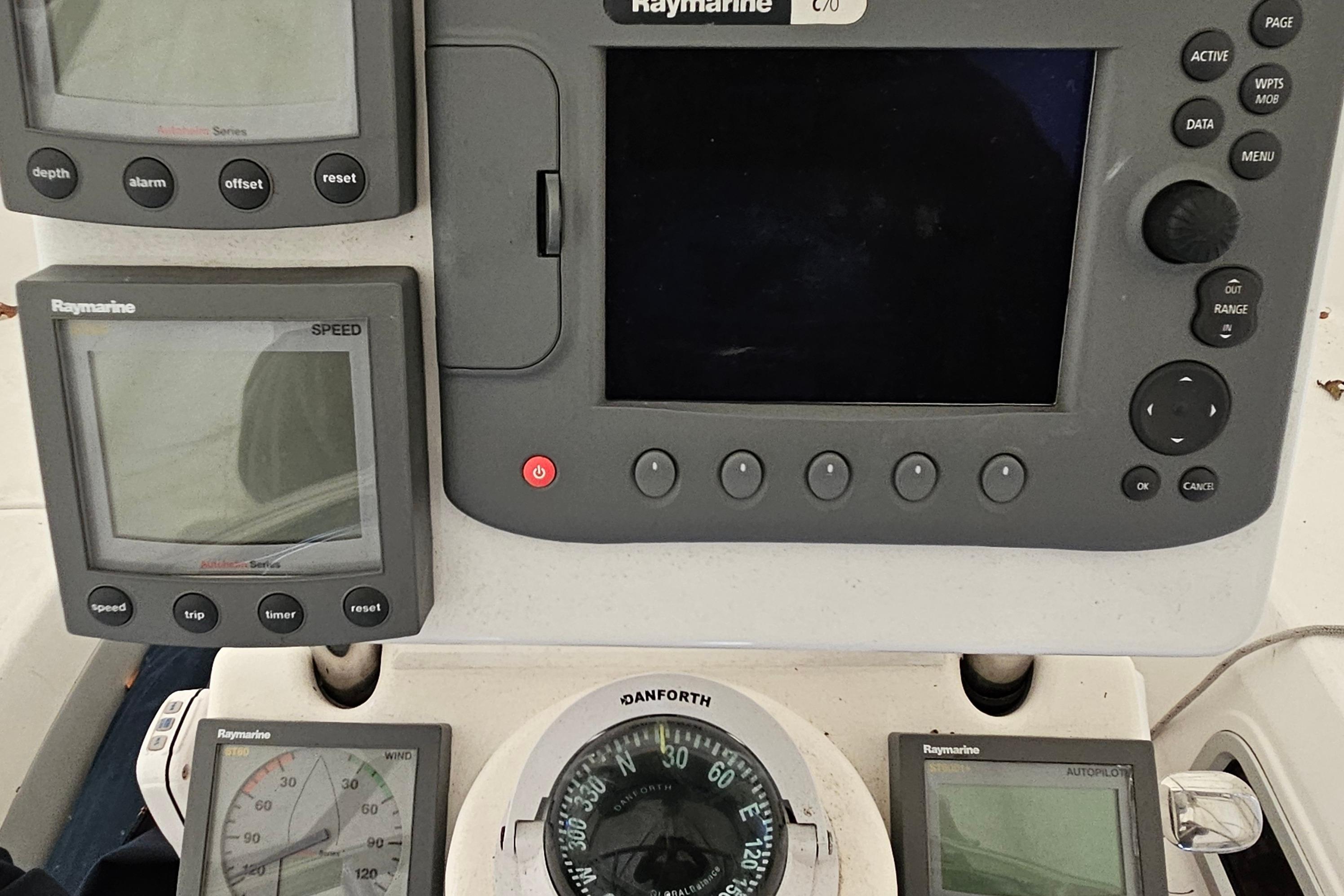 Control panel of a 2004 Hunter 386 sailboat with Raymarine navigation instruments.