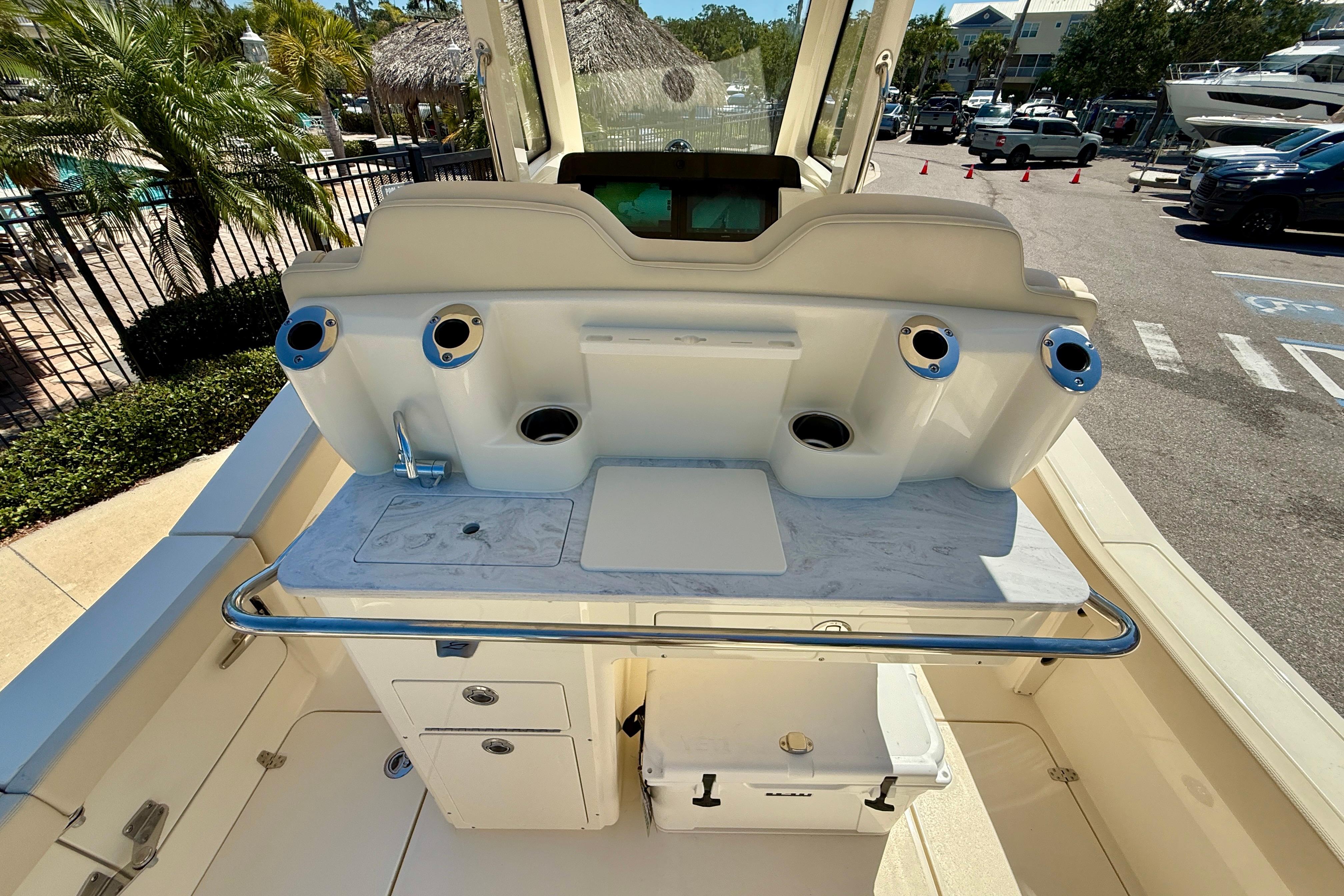 2026 Scout 260 LXF boat interior with fishing rod holders and storage compartments.