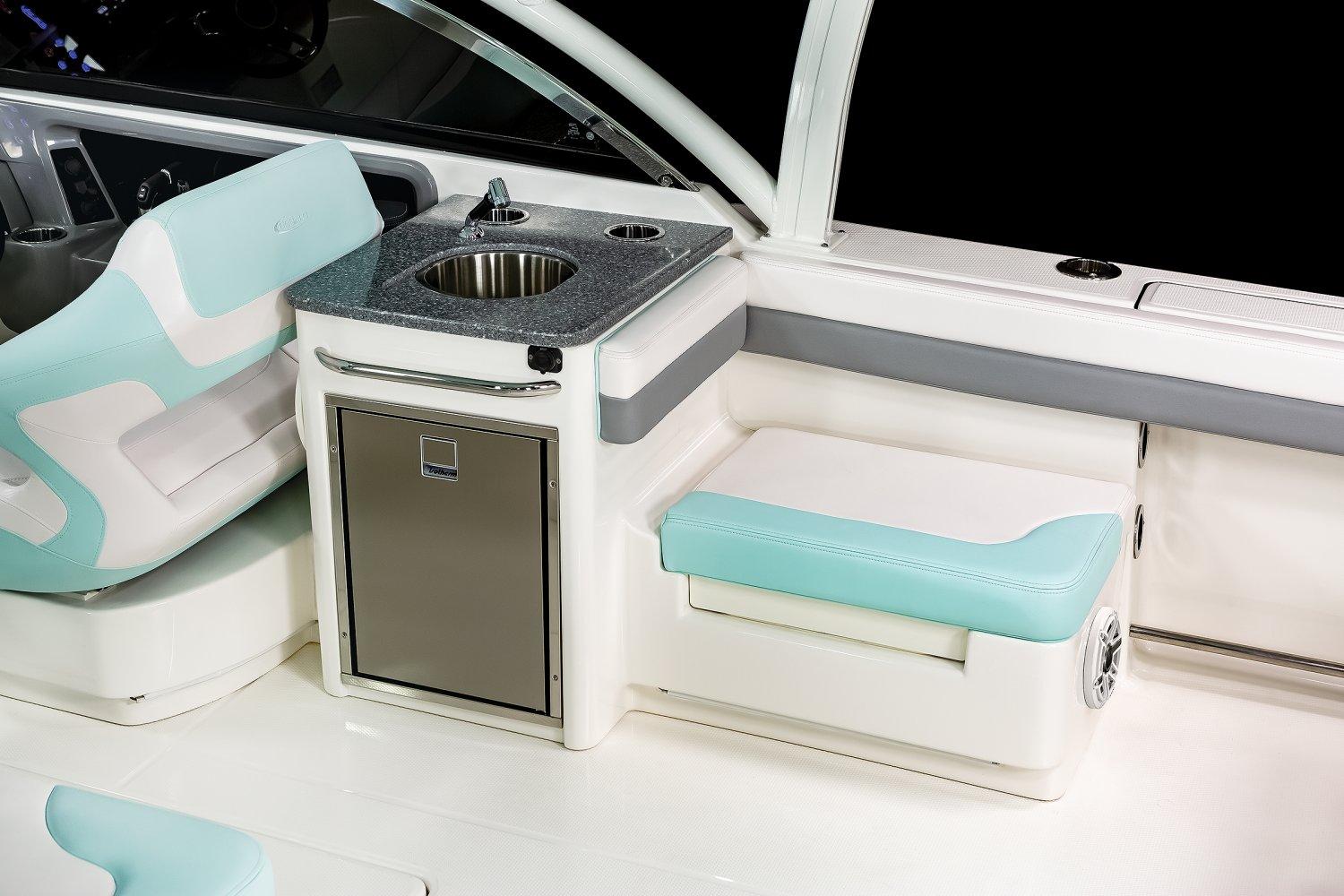 Manufacturer Provided Image: 2025 Robalo R317 Dual Console interior with sink and seating area.