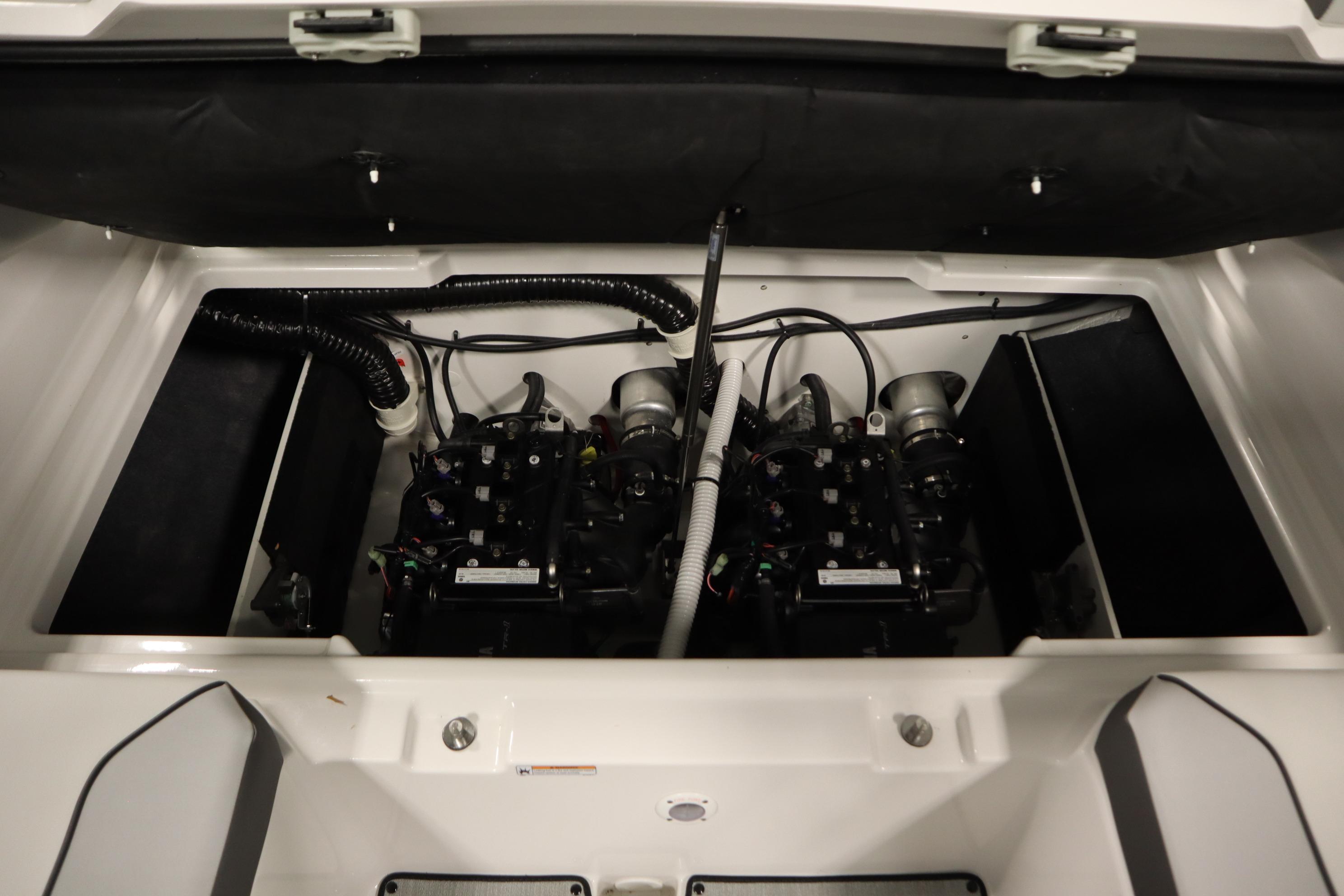 2026 Yamaha Boats AR220 engine compartment with dual engines and wiring.