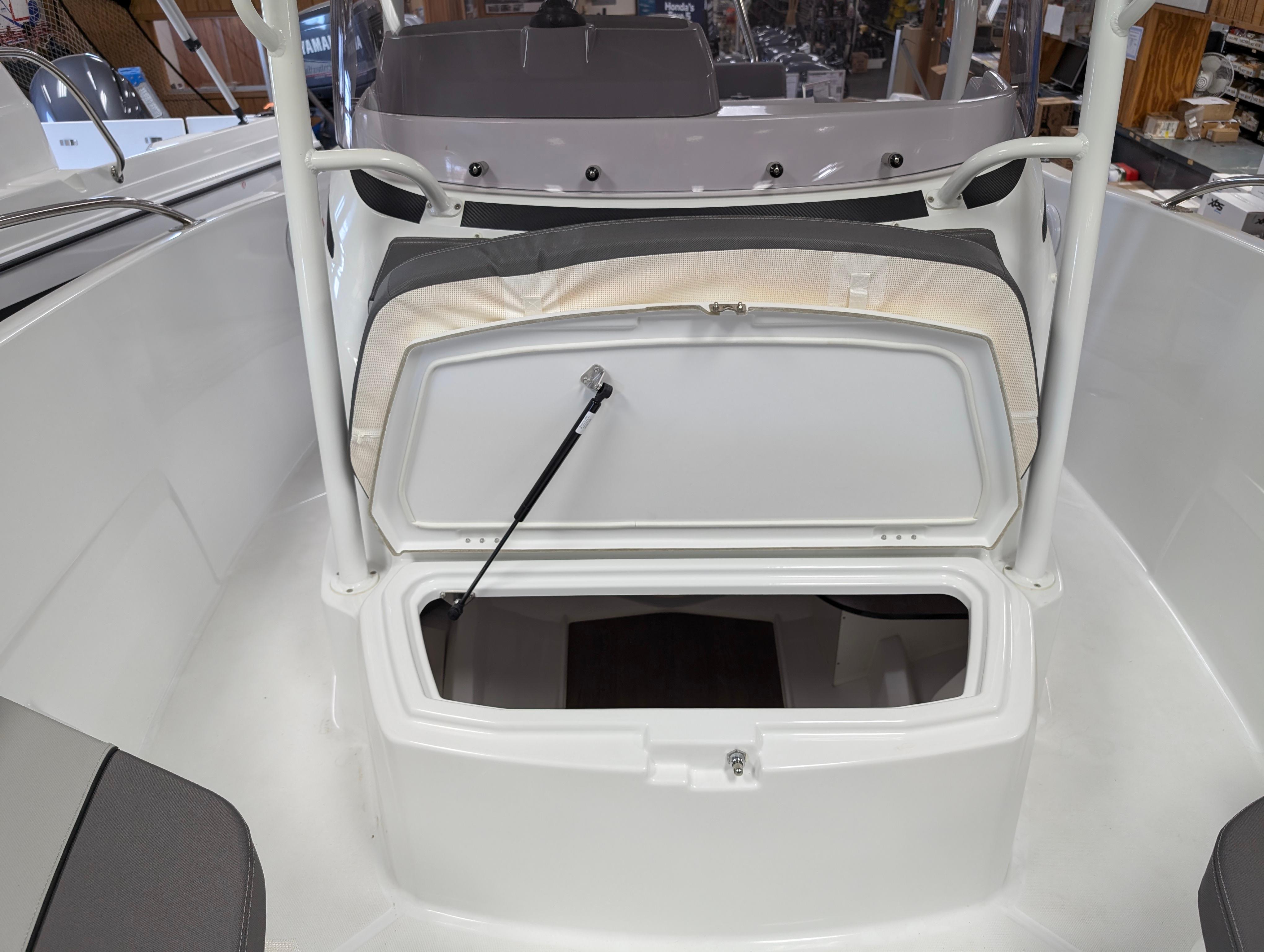 2023 Jeanneau Leader 6.5 S3 CC boat with open storage compartment.